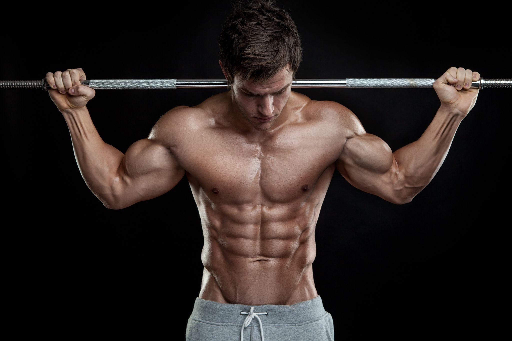 Shirtless muscular bodybuilder, Steel barbell overhead hold, Gray sweatpants Shirtless muscular bodybuilder, Steel barbell overhead hold, Gray sweatpants — 2048×1365 HD wallpaper