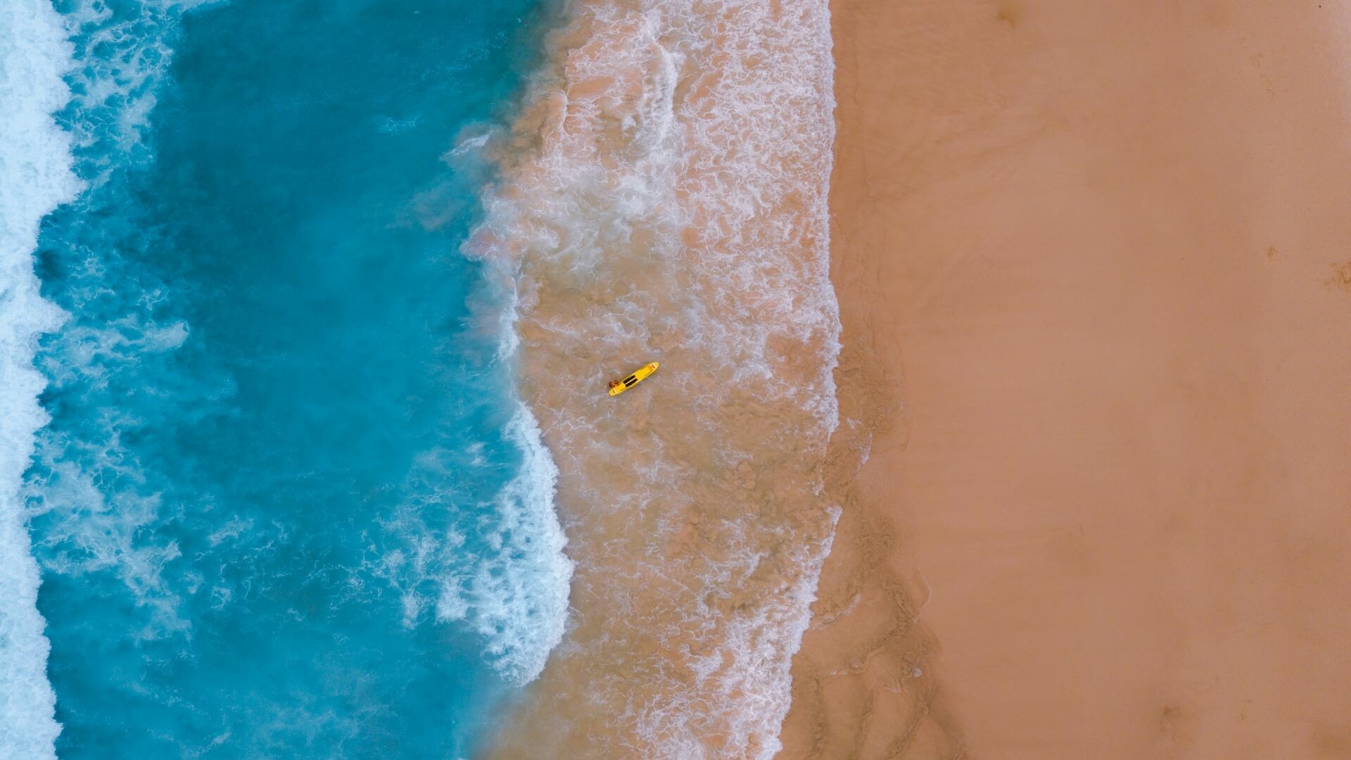 Aerial beach drone shot, Yellow surfboard shoreline, Turquoise ocean waves — 1920×1080 HD wallpaper