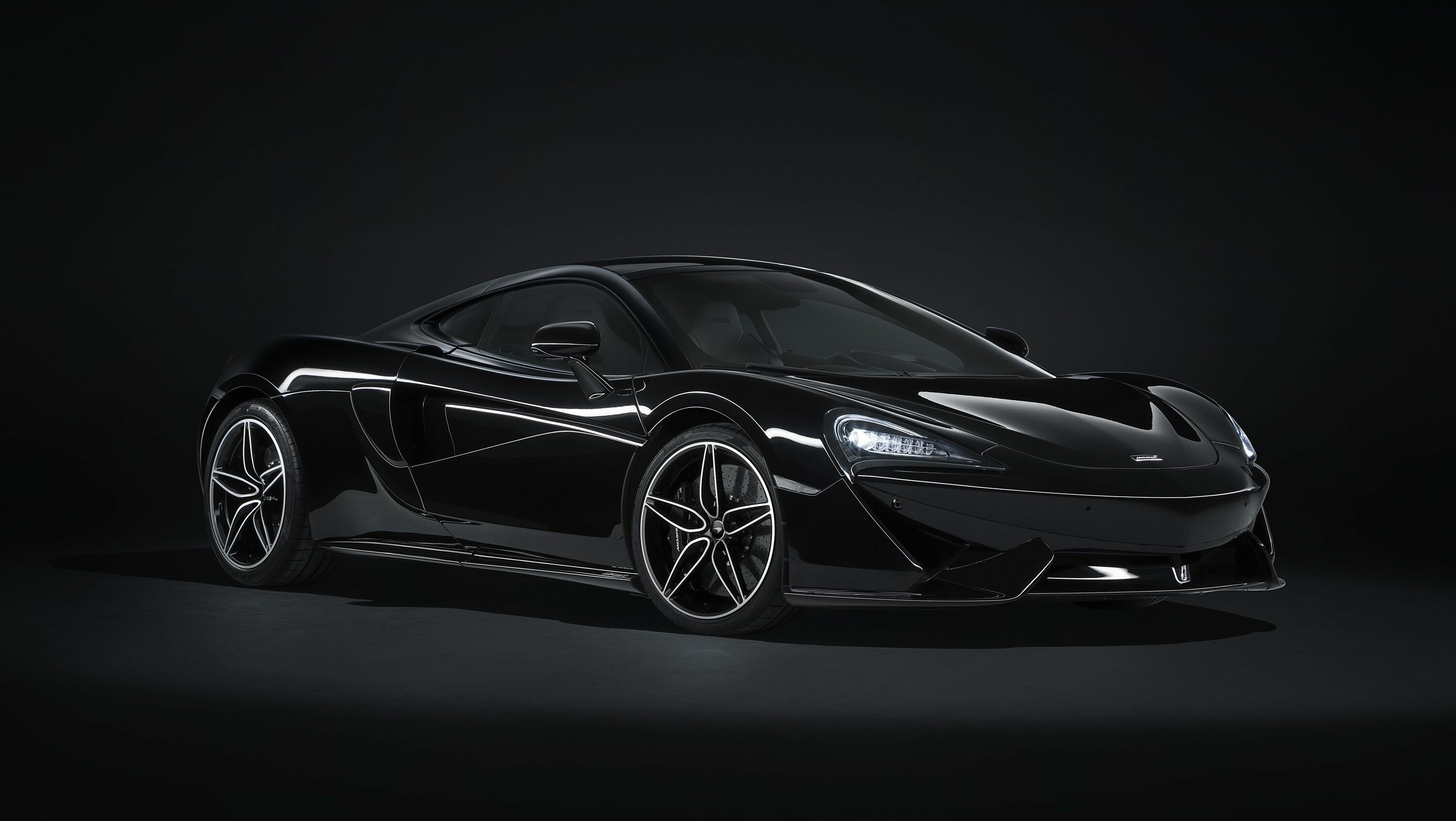 McLaren 570GT, Black sports car, Dark studio backdrop McLaren 570GT, Black sports car, Dark studio backdrop — 3000×1691 HD wallpaper