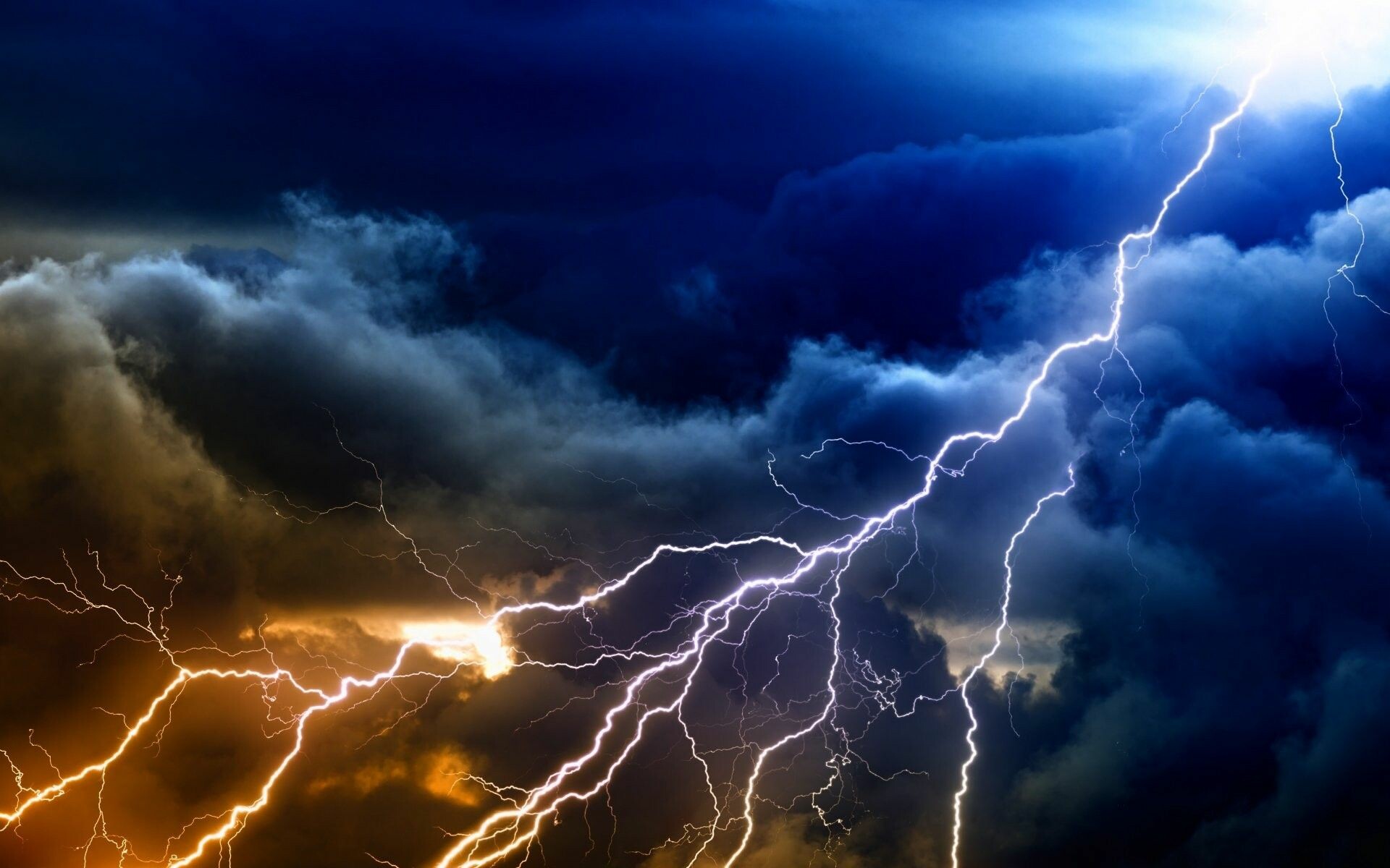 Forked lightning bolts, Dark storm clouds, Orange blue sky Forked lightning bolts, Dark storm clouds, Orange blue sky — 1920×1200 HD wallpaper