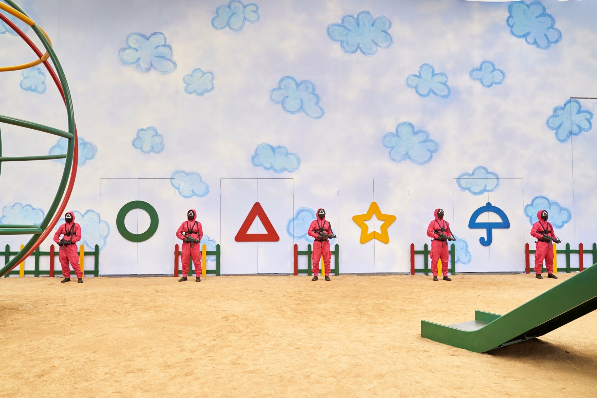 Pink masked guards, Dalgona shapes wall, Playground game arena, Cloud mural backdrop Pink masked guards, Dalgona shapes wall, Playground game arena, Cloud mural backdrop — 1920×1280 HD wallpaper