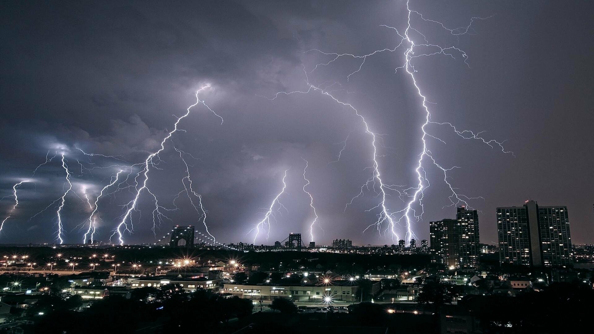 Multiple lightning bolts, Nighttime city skyline, Dark stormy clouds Multiple lightning bolts, Nighttime city skyline, Dark stormy clouds — 1920×1080 HD wallpaper
