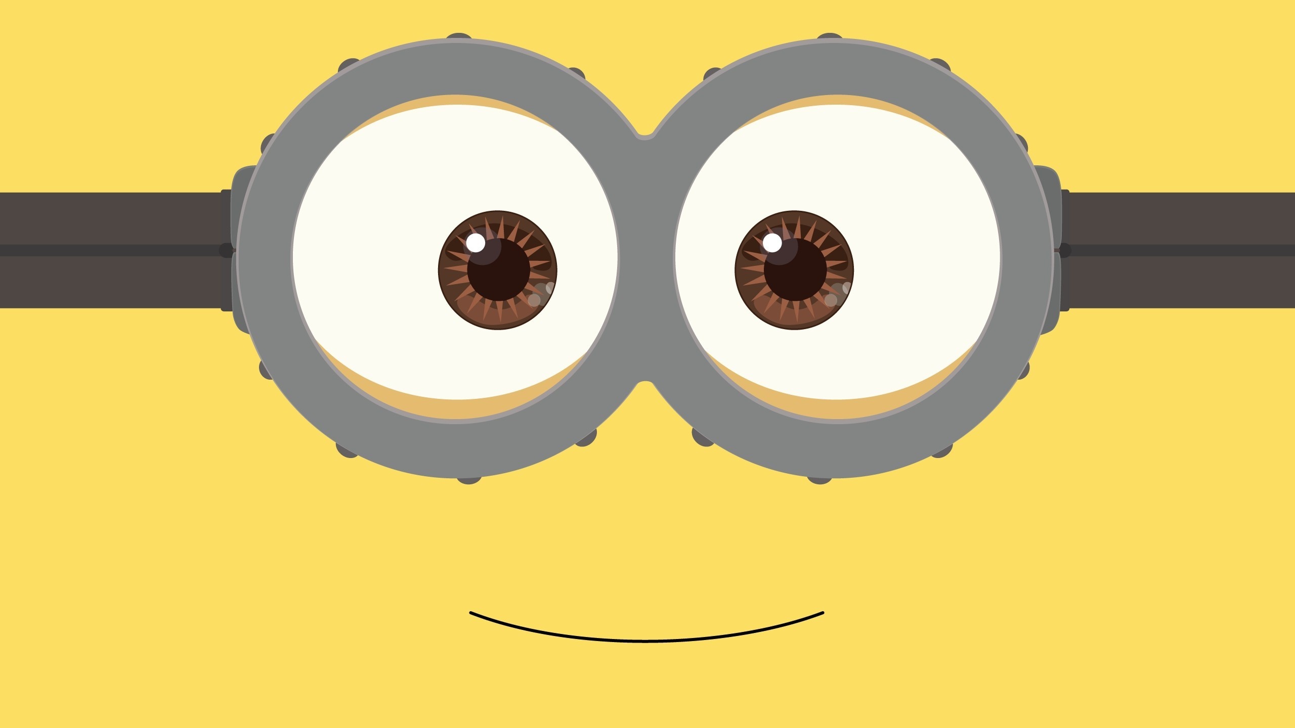 Minion goggles close-up, Two-eyed Minion smile, Flat yellow background Minion goggles close-up, Two-eyed Minion smile, Flat yellow background — 2560×1440 HD wallpaper