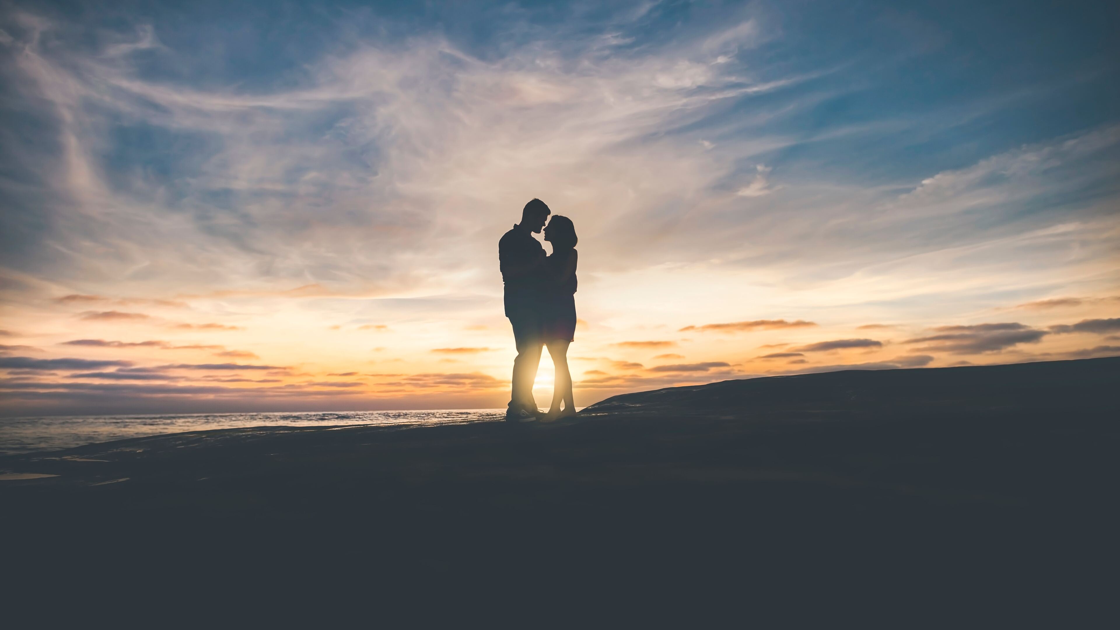 Couple embracing silhouette, Sunset beach dune, Blue golden sky Couple embracing silhouette, Sunset beach dune, Blue golden sky — 3840×2160 HD wallpaper