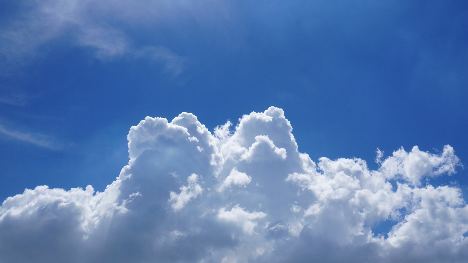 Cumulus cloud formation, Wispy cirrus streaks, Deep blue sky Cumulus cloud formation, Wispy cirrus streaks, Deep blue sky — 1920×1080 HD wallpaper