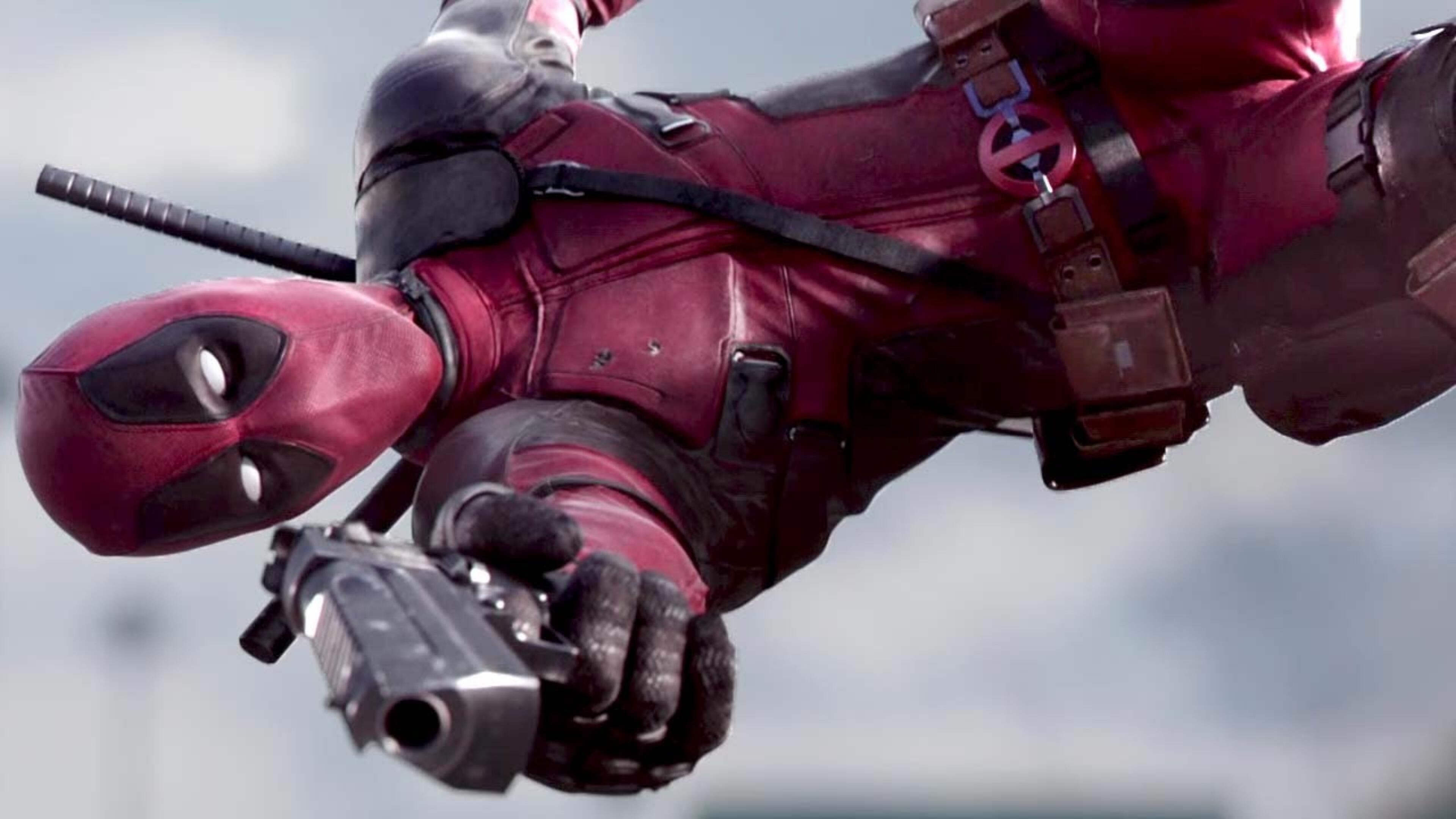 Deadpool logo belt, Midair diving shot, Firing black pistol Deadpool logo belt, Midair diving shot, Firing black pistol — 3840×2160 HD wallpaper