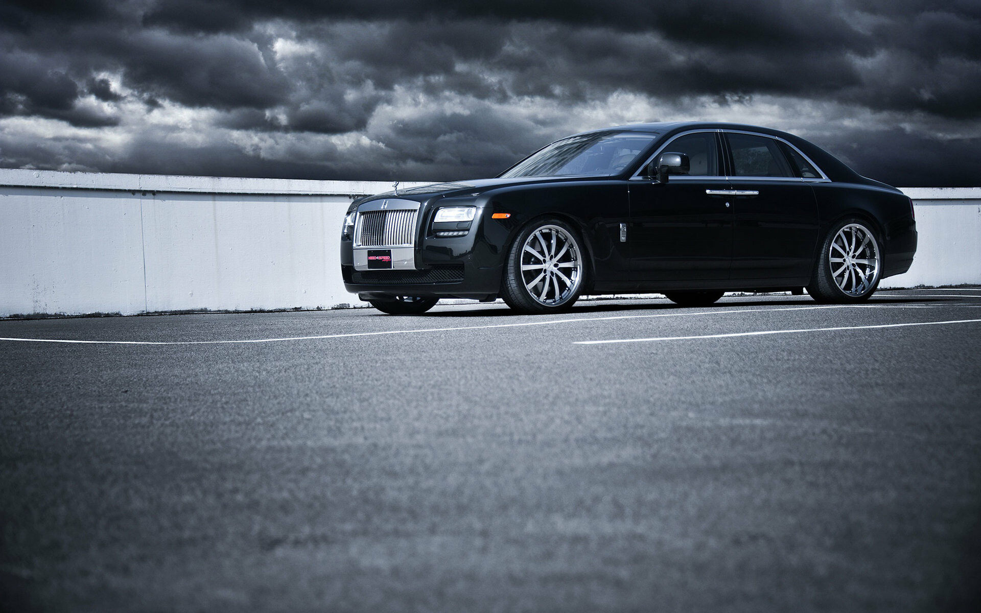 Black Rolls-Royce Ghost sedan, Aftermarket chrome wheels, Stormy sky parking lot Black Rolls-Royce Ghost sedan, Aftermarket chrome wheels, Stormy sky parking lot — 1920×1200 HD wallpaper