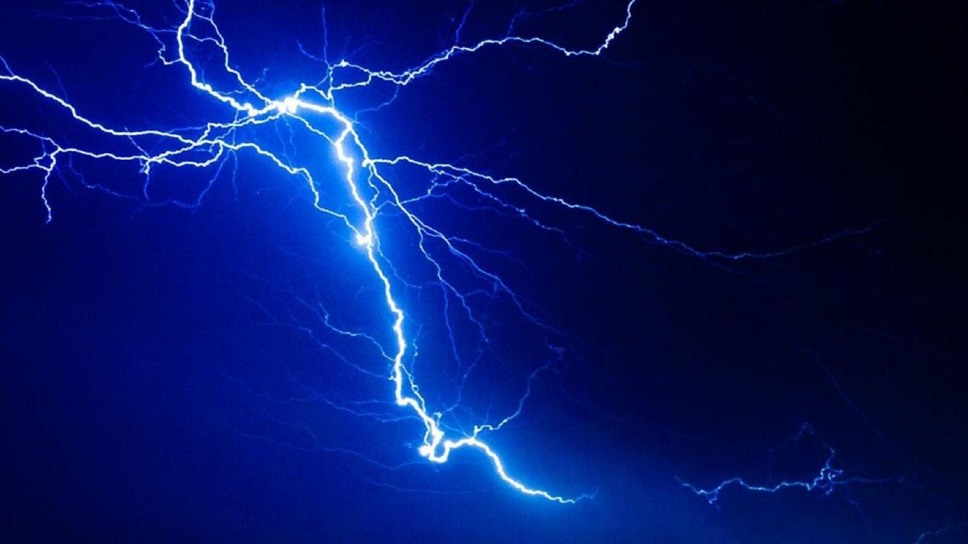 Forked lightning bolt, Branching electric arcs, Dark blue night sky Forked lightning bolt, Branching electric arcs, Dark blue night sky — 1920×1080 HD wallpaper