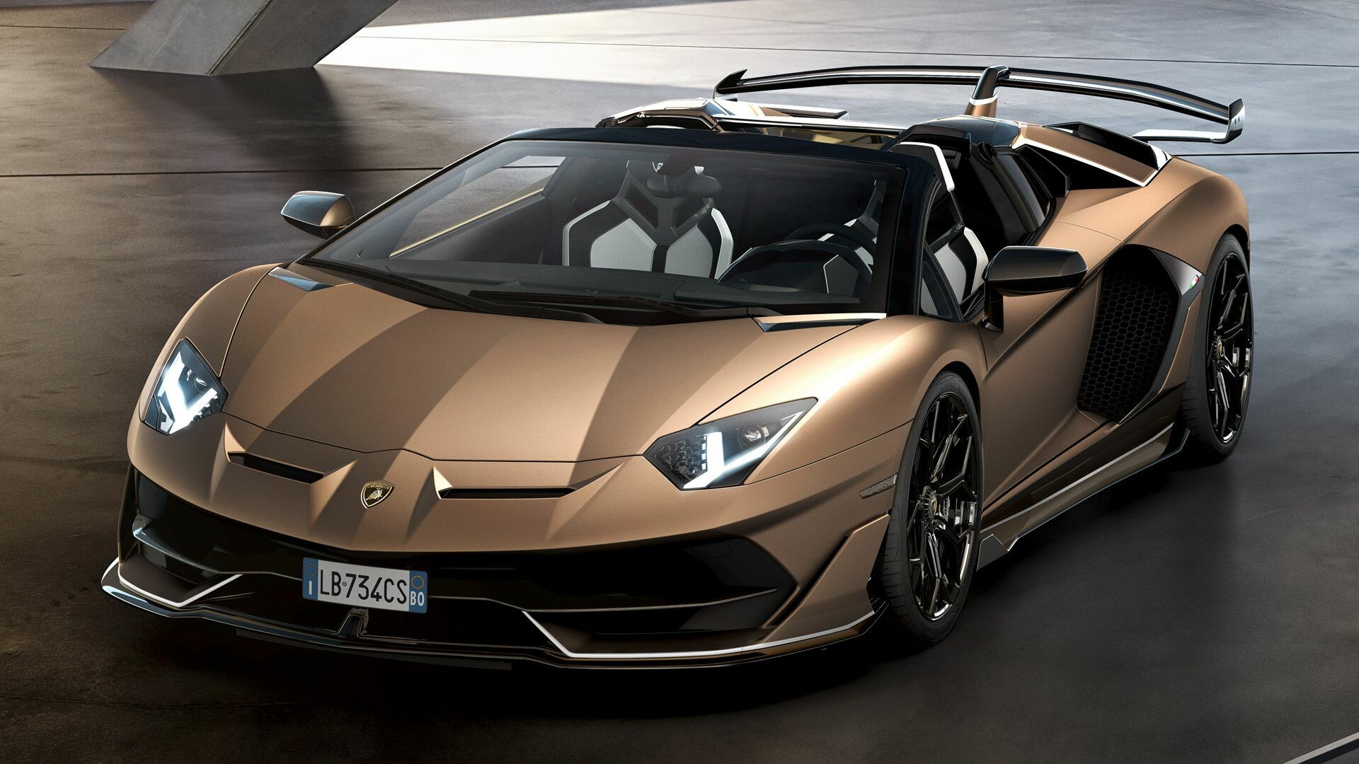 Bronze Aventador SVJ roadster, High-angle front view, Carbon rear wing Bronze Aventador SVJ roadster, High-angle front view, Carbon rear wing — 1920×1080 HD wallpaper
