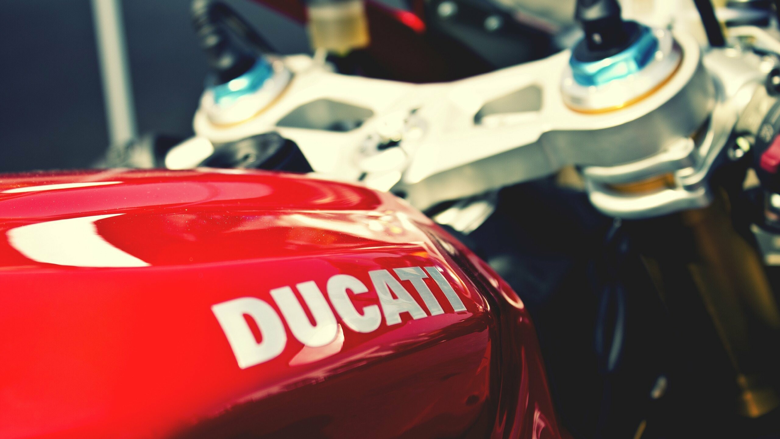 Ducati logo decal, Red fuel tank, Chrome triple clamp Ducati logo decal, Red fuel tank, Chrome triple clamp — 2560×1440 HD wallpaper