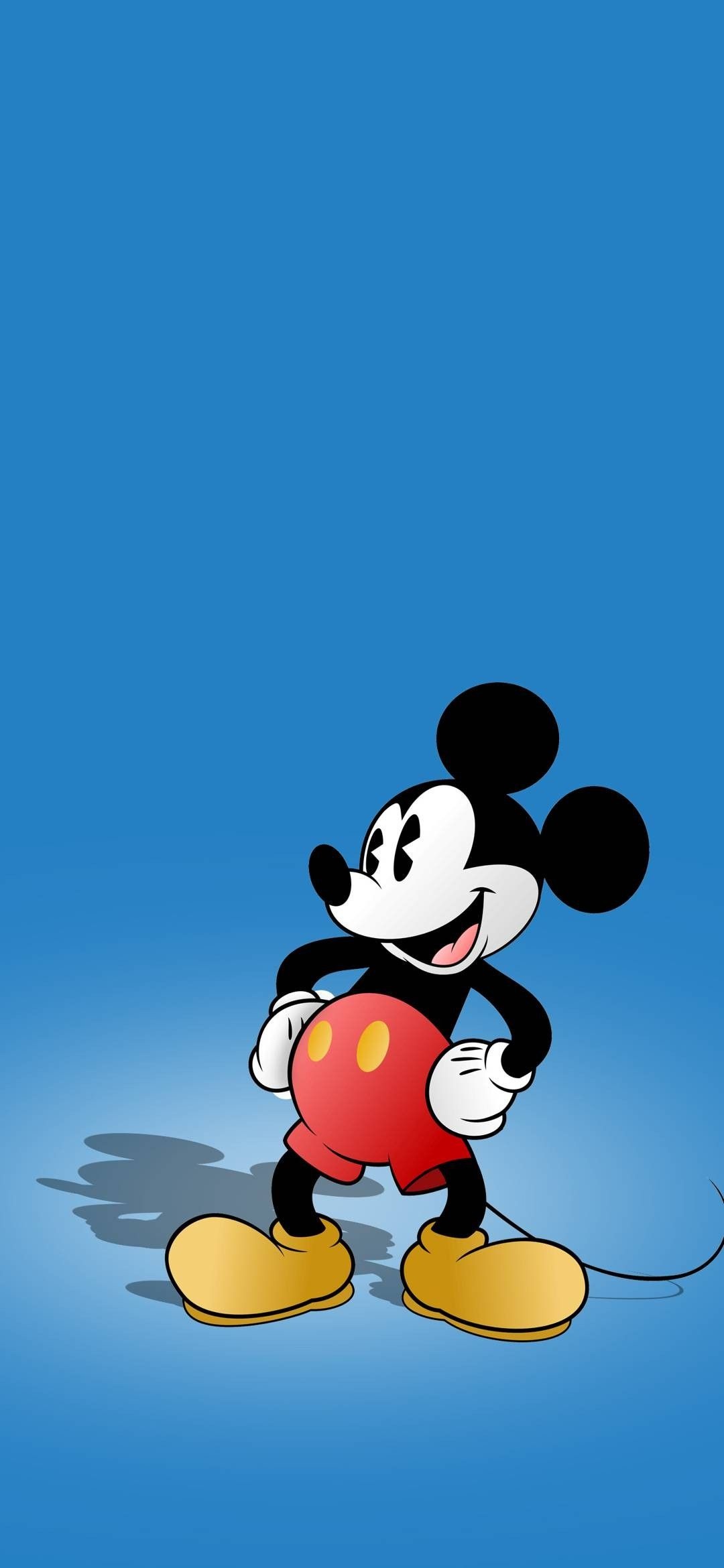 Mickey Mouse, Classic red shorts, Blue gradient backdrop Mickey Mouse, Classic red shorts, Blue gradient backdrop — 1080×2340 HD wallpaper