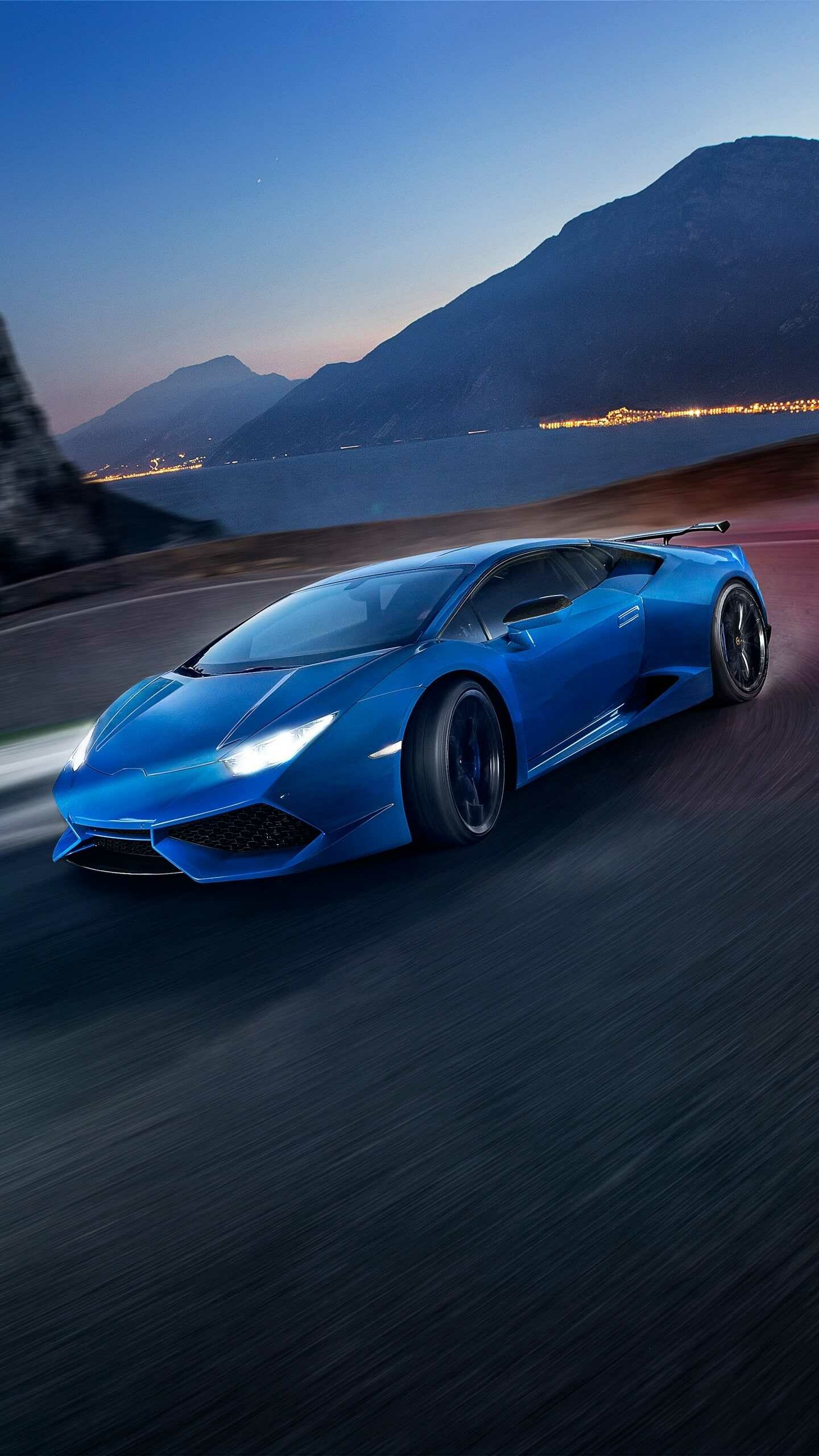 Blue Lamborghini Huracan, Mountain lake dusk, Rear wing driving Blue Lamborghini Huracan, Mountain lake dusk, Rear wing driving — 1440×2560 HD wallpaper