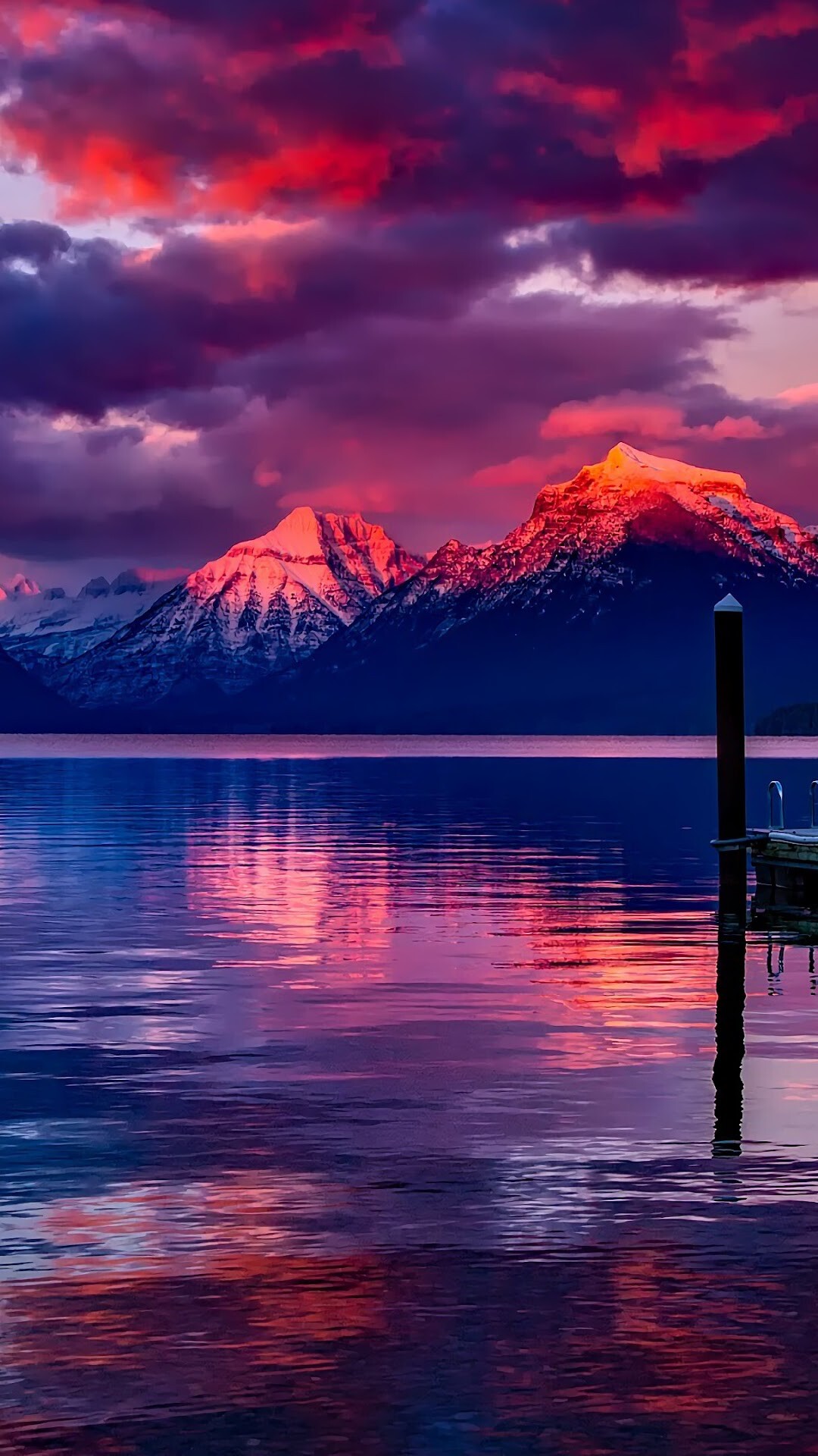 Lake McDonald, Glacier National Park, Wooden dock piling, Sunset cloud reflection Lake McDonald, Glacier National Park, Wooden dock piling, Sunset cloud reflection — 1080×1920 HD wallpaper