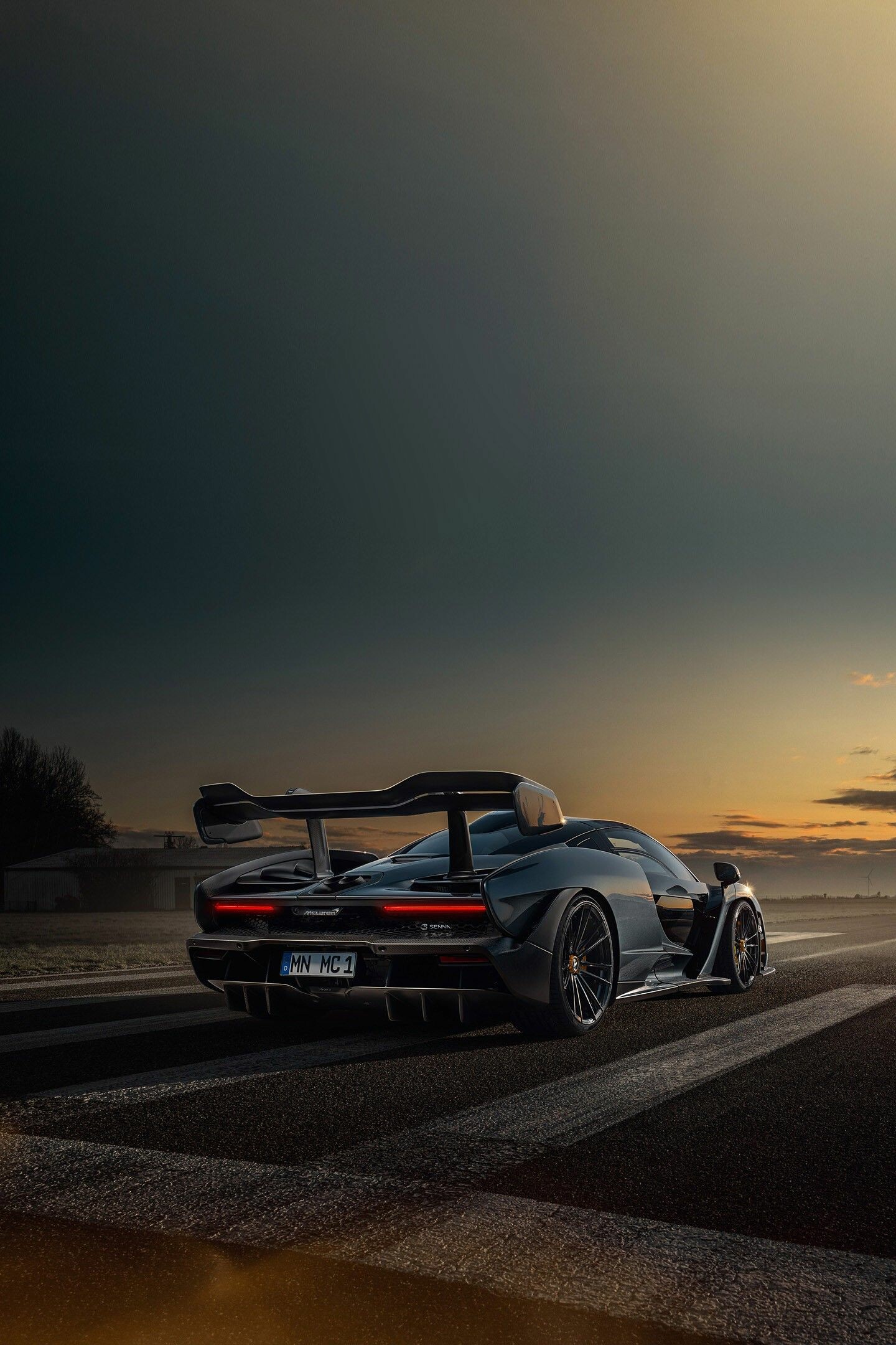 McLaren Senna, Rear wing spoiler, Sunset airstrip runway McLaren Senna, Rear wing spoiler, Sunset airstrip runway — 1440×2160 HD wallpaper