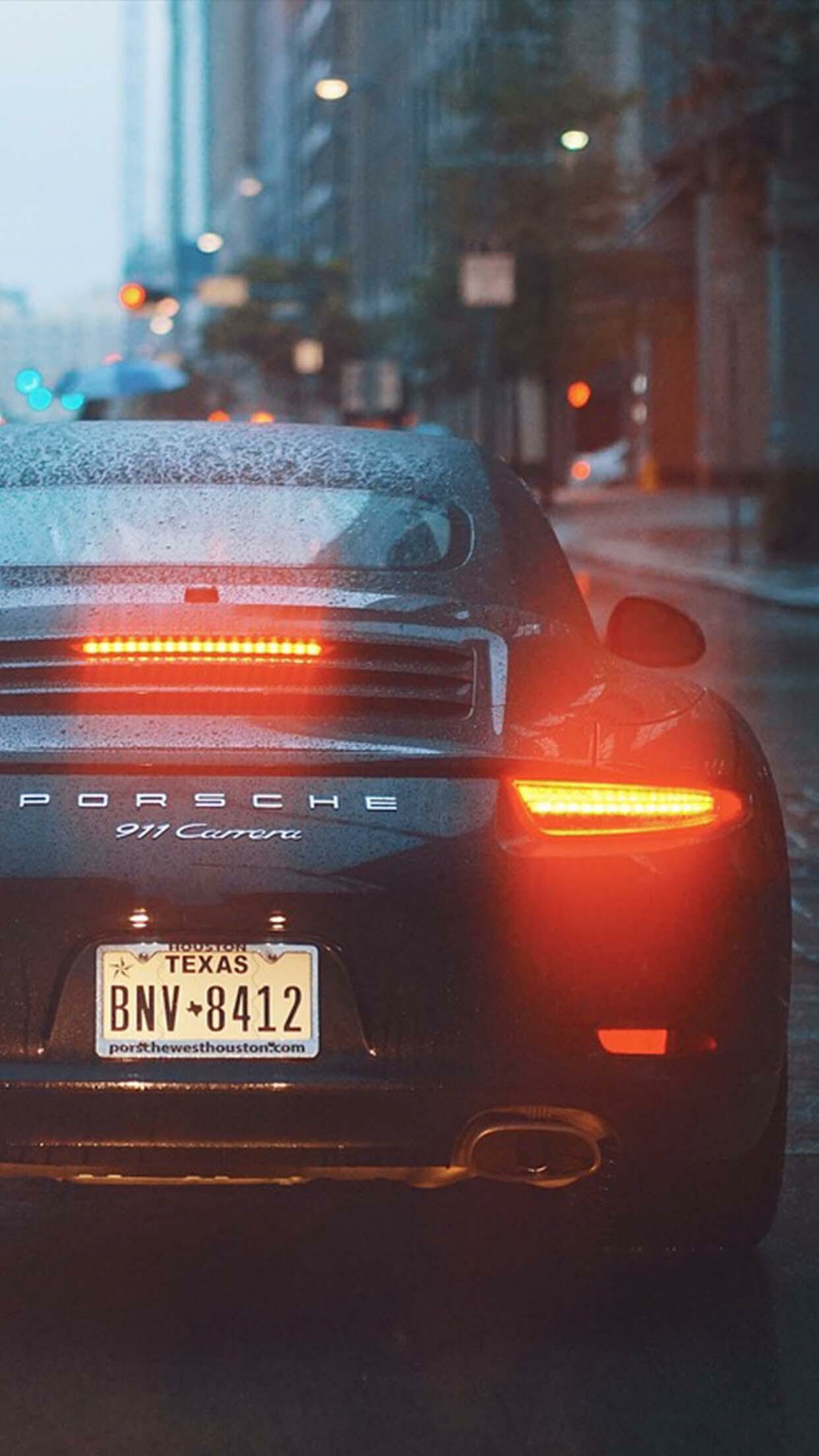 911 Carrera, Black rain-soaked rear, Texas license plate 911 Carrera, Black rain-soaked rear, Texas license plate — 1242×2208 HD wallpaper