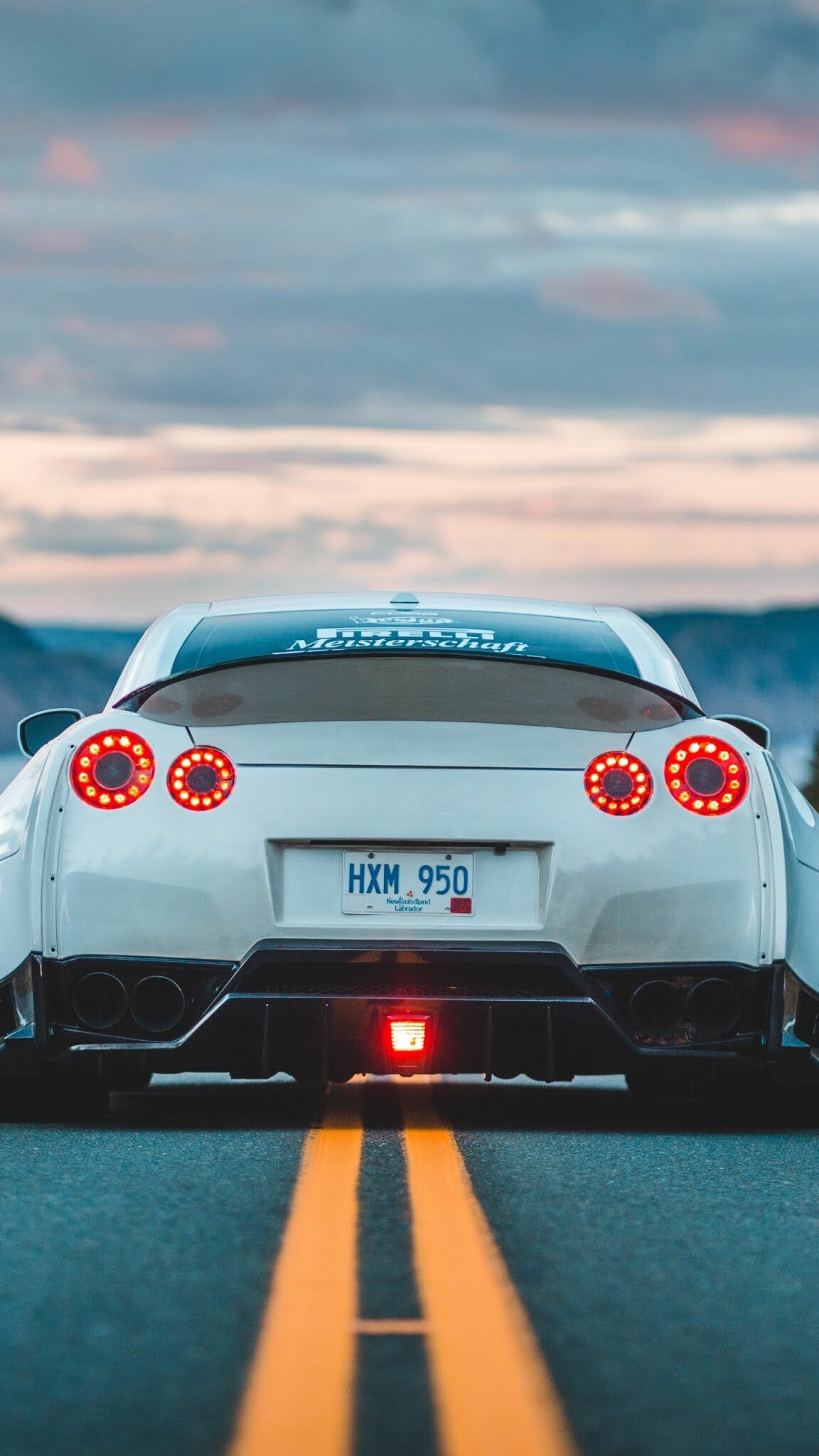 Nissan GT-R R35, HXM 950 plate, Sunset mountain road Nissan GT-R R35, HXM 950 plate, Sunset mountain road — 1152×2048 HD wallpaper