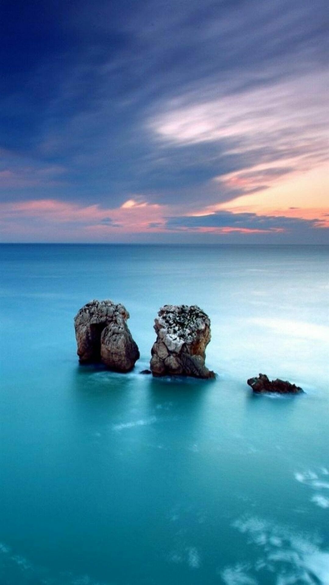 Rocky sea stacks, Turquoise calm ocean, Pink sunset clouds Rocky sea stacks, Turquoise calm ocean, Pink sunset clouds — 1080×1920 HD wallpaper
