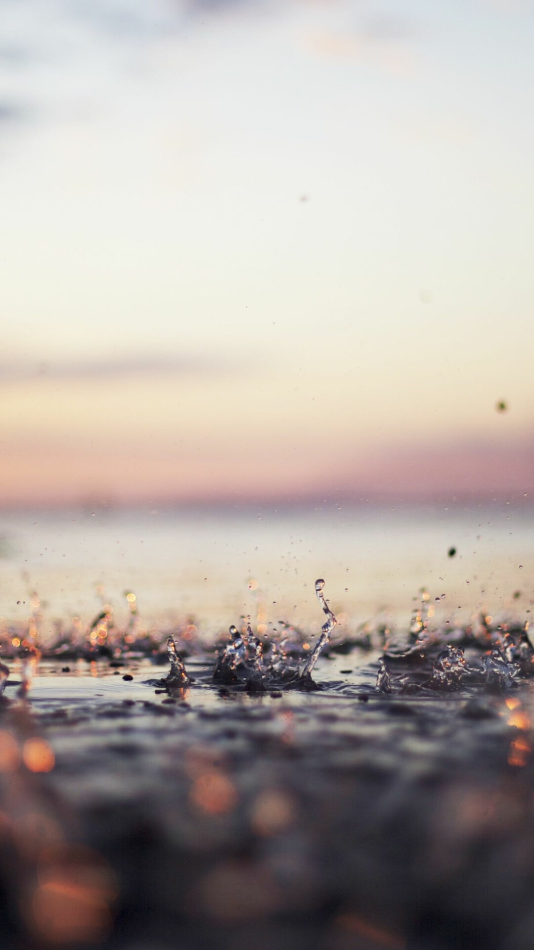 Water droplet splashes, Sunset ocean horizon, Wet pebble shore Water droplet splashes, Sunset ocean horizon, Wet pebble shore — 1080×1920 HD wallpaper