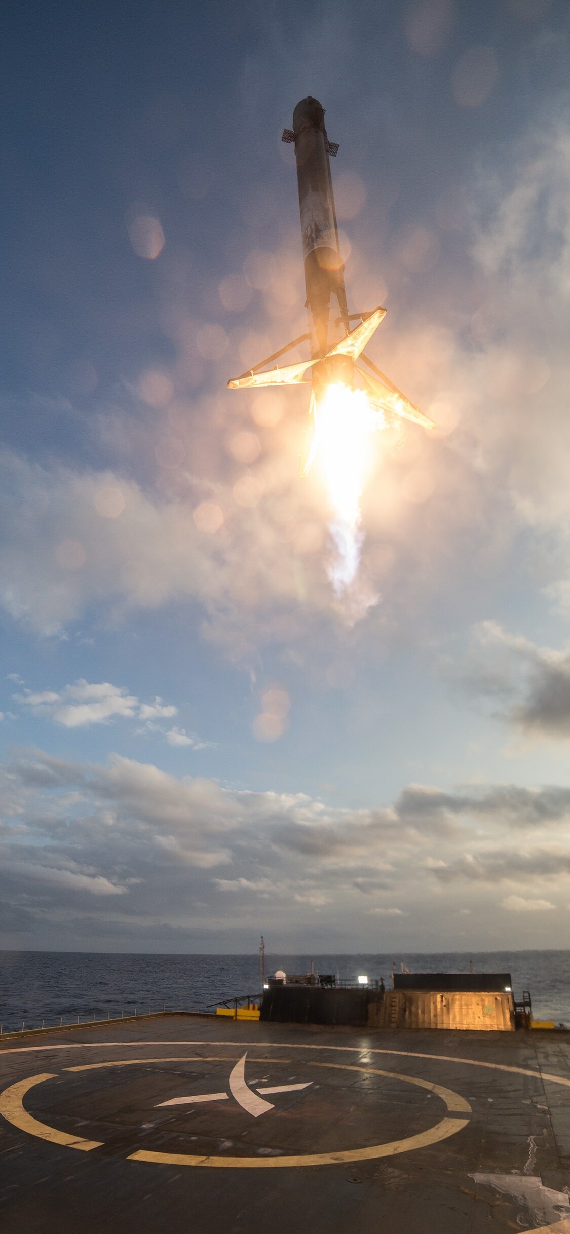 SpaceX Falcon 9 booster, Autonomous droneship landing, Rocket engine plume SpaceX Falcon 9 booster, Autonomous droneship landing, Rocket engine plume — 1125×2436 HD wallpaper