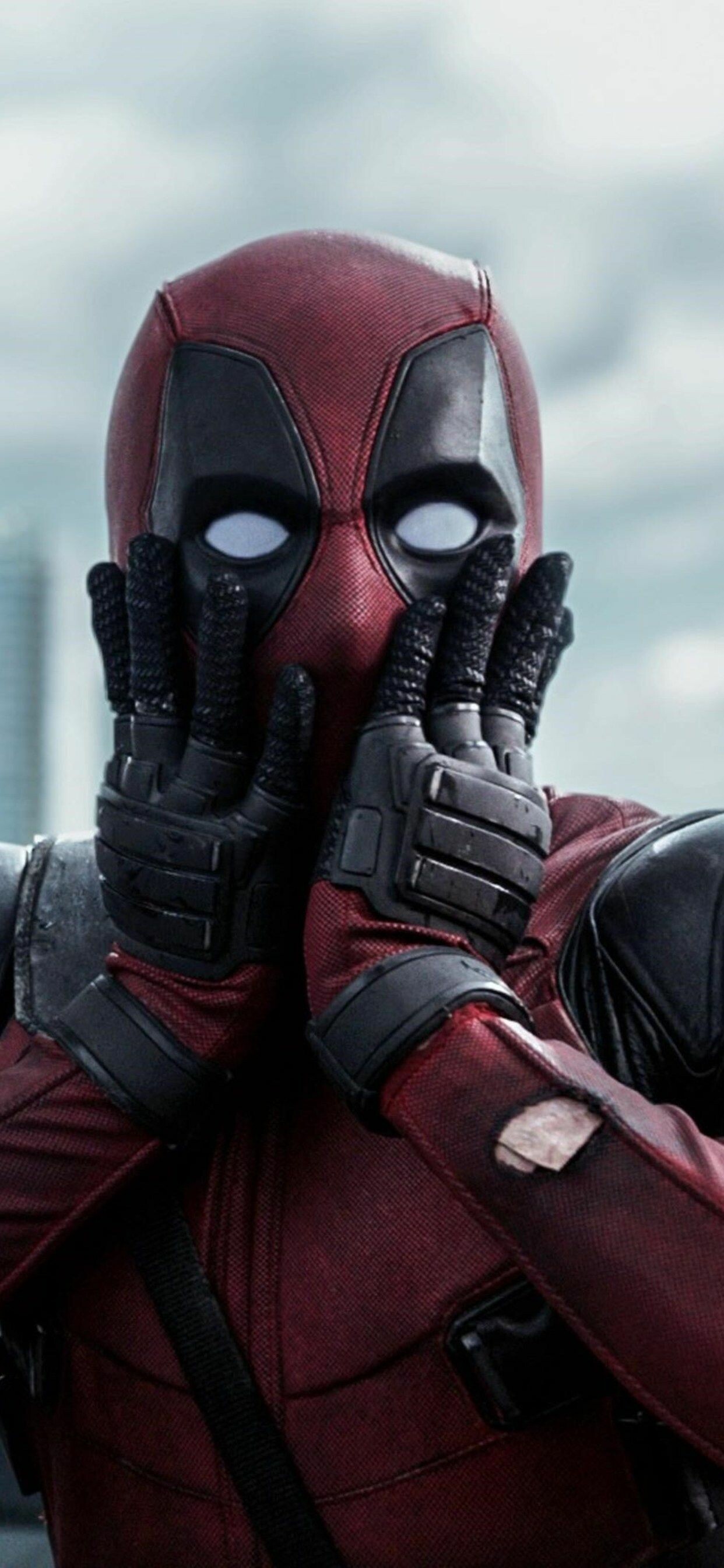 Deadpool hands-on-cheeks shock, Movie still close-up, Wide white eyes Deadpool hands-on-cheeks shock, Movie still close-up, Wide white eyes — 1242×2688 HD wallpaper