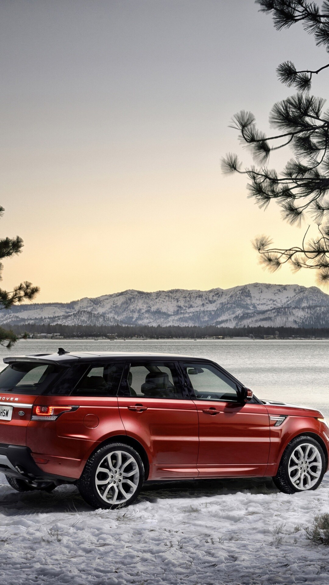 Red Range Rover Sport, Snowy lakeshore, Mountain sunset backdrop Red Range Rover Sport, Snowy lakeshore, Mountain sunset backdrop — 1080×1920 HD wallpaper