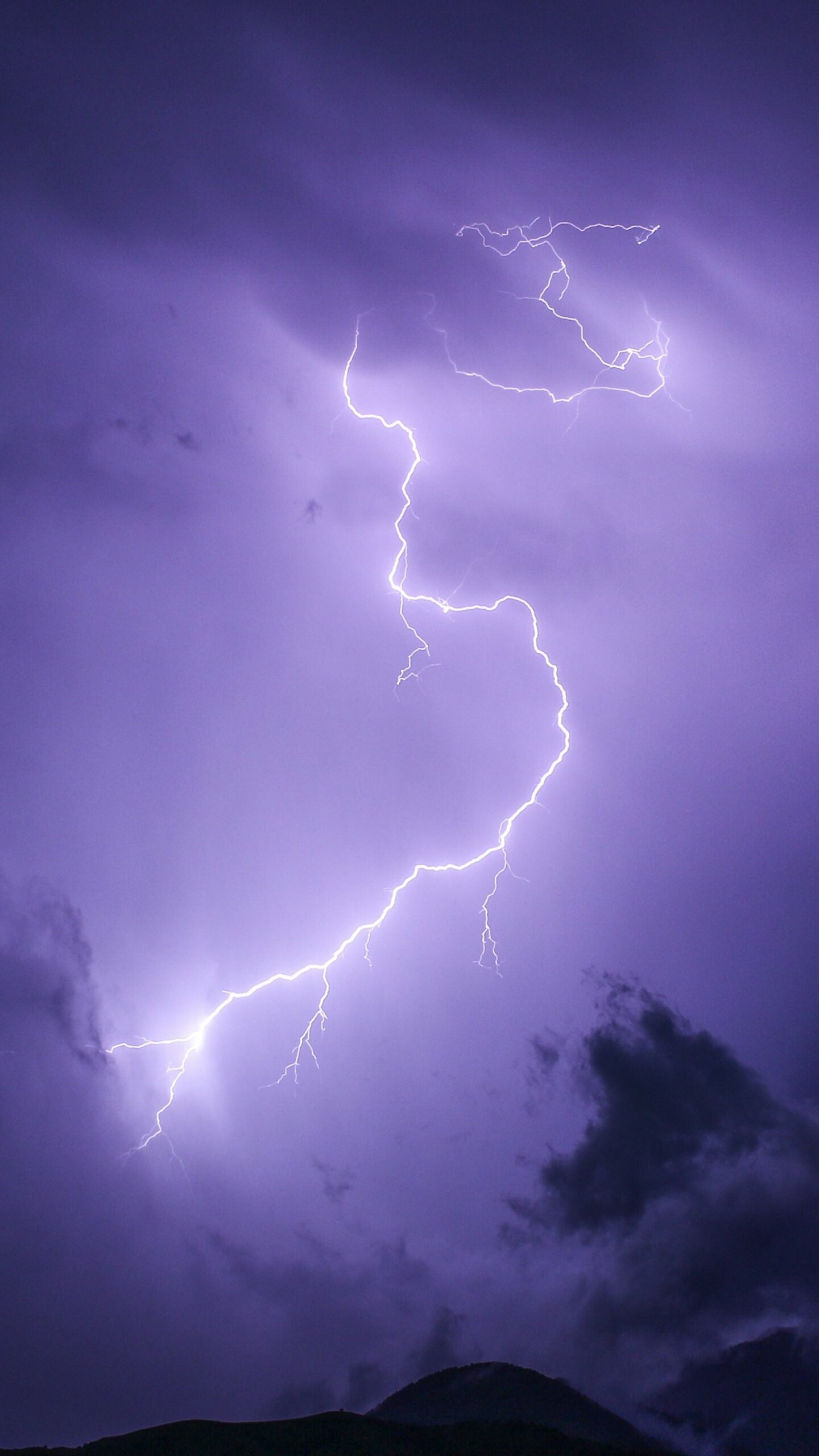 Forked lightning bolt, Purple storm clouds, Dark mountain silhouette Forked lightning bolt, Purple storm clouds, Dark mountain silhouette — 1440×2560 HD wallpaper