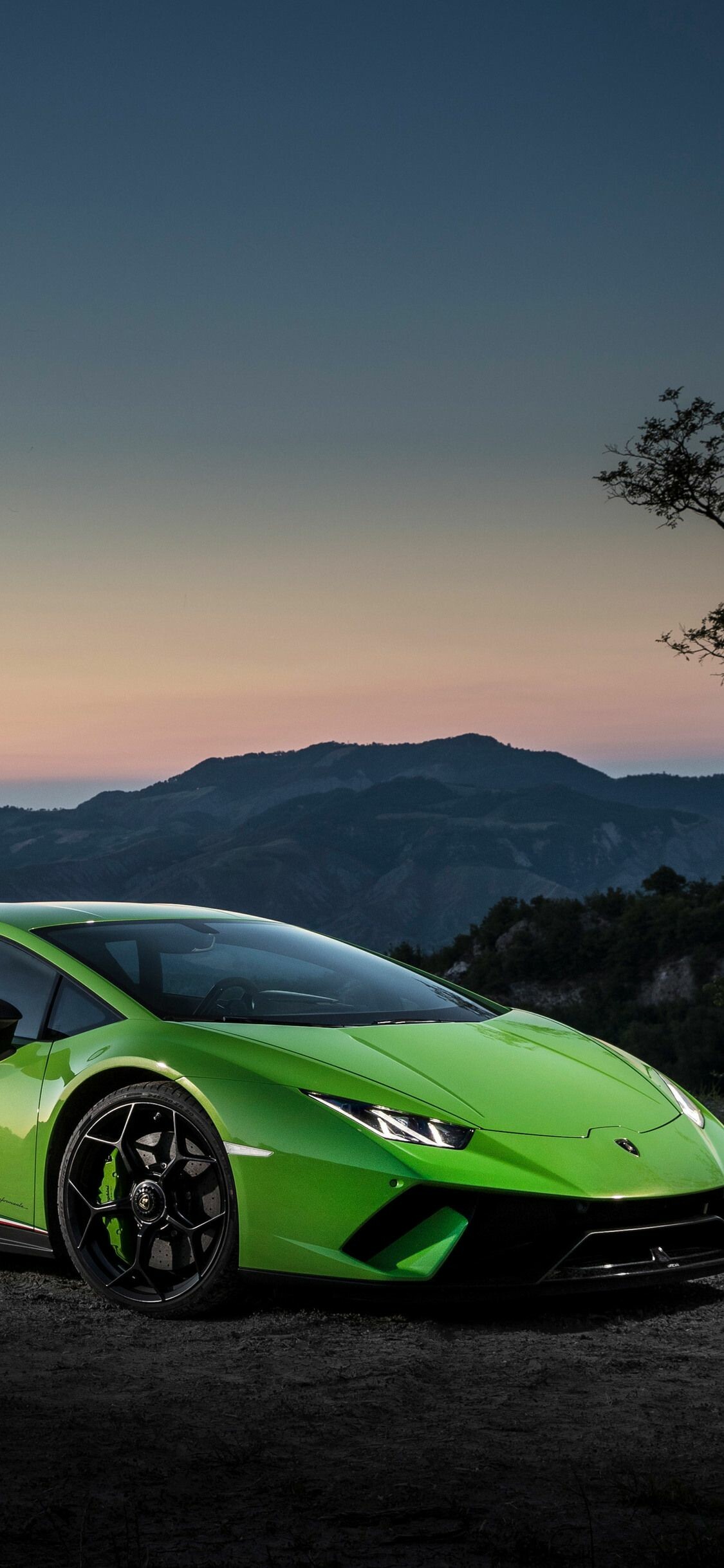 Green Huracan Performante, Sunset mountain backdrop, Side profile view Green Huracan Performante, Sunset mountain backdrop, Side profile view — 1125×2436 HD wallpaper