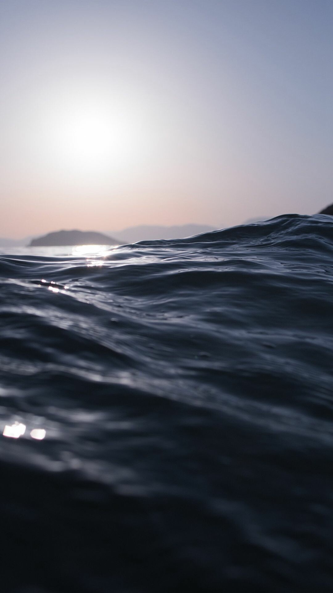 Hazy sun horizon, Distant island silhouette, Rippling ocean surface Hazy sun horizon, Distant island silhouette, Rippling ocean surface — 1080×1920 HD wallpaper
