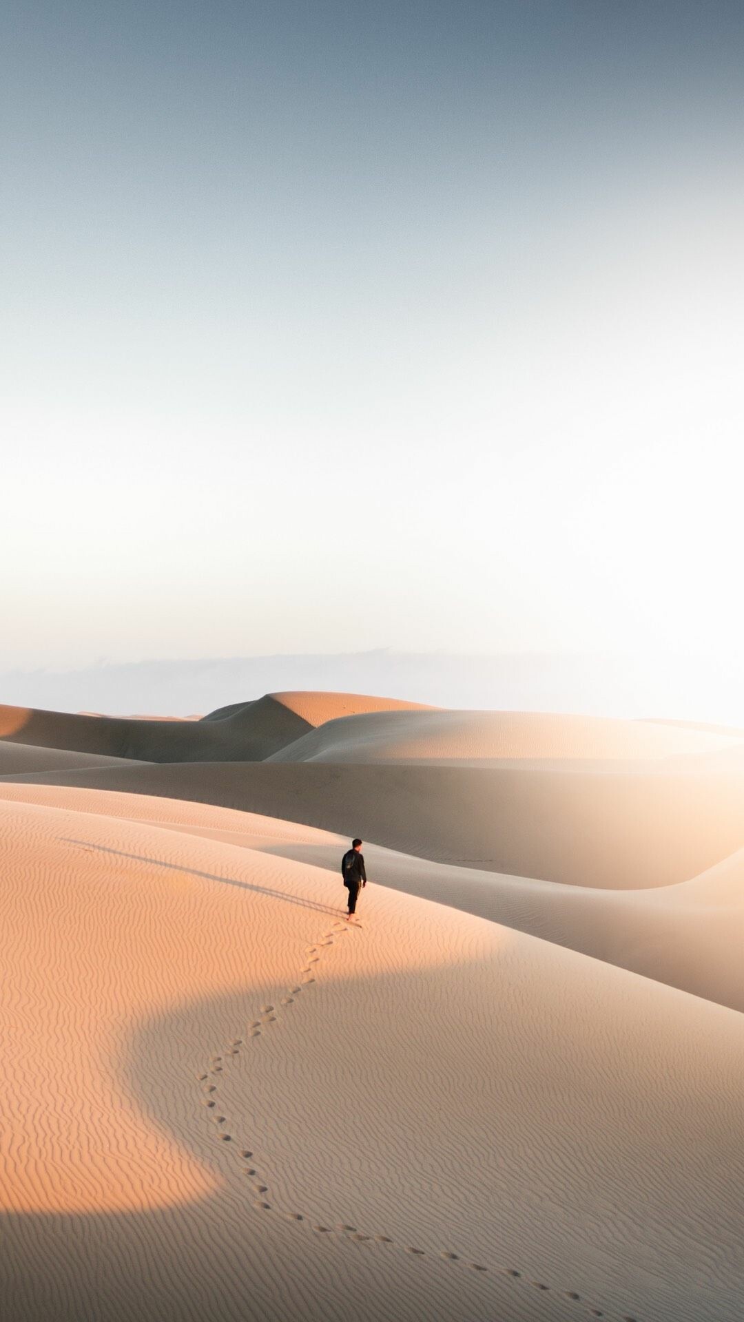 Lone hiker on dune, Curving footprints trail, Golden sand dunes Lone hiker on dune, Curving footprints trail, Golden sand dunes — 1080×1920 HD wallpaper
