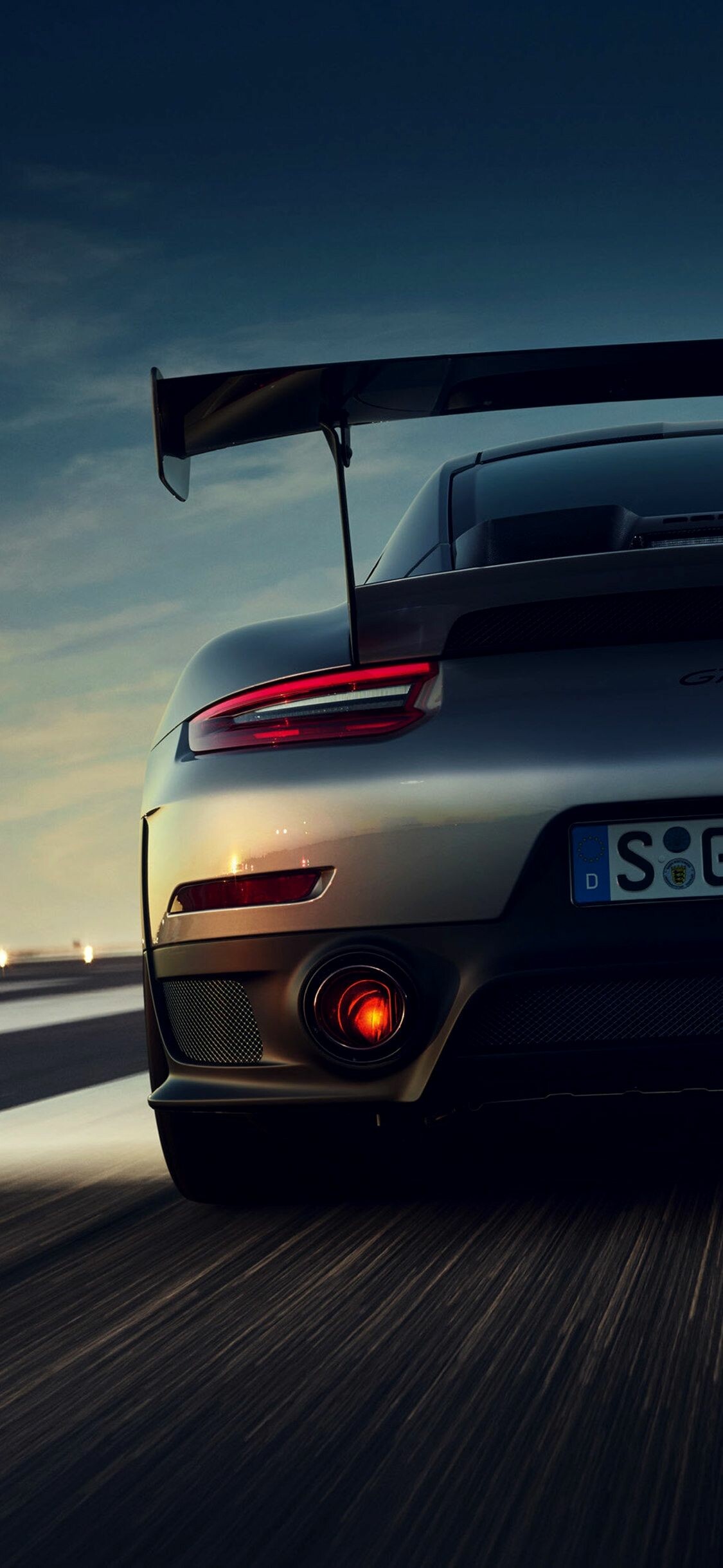 Porsche 911 GT2 RS, Carbon rear wing, Dusk highway rear view Porsche 911 GT2 RS, Carbon rear wing, Dusk highway rear view — 1125×2436 HD wallpaper