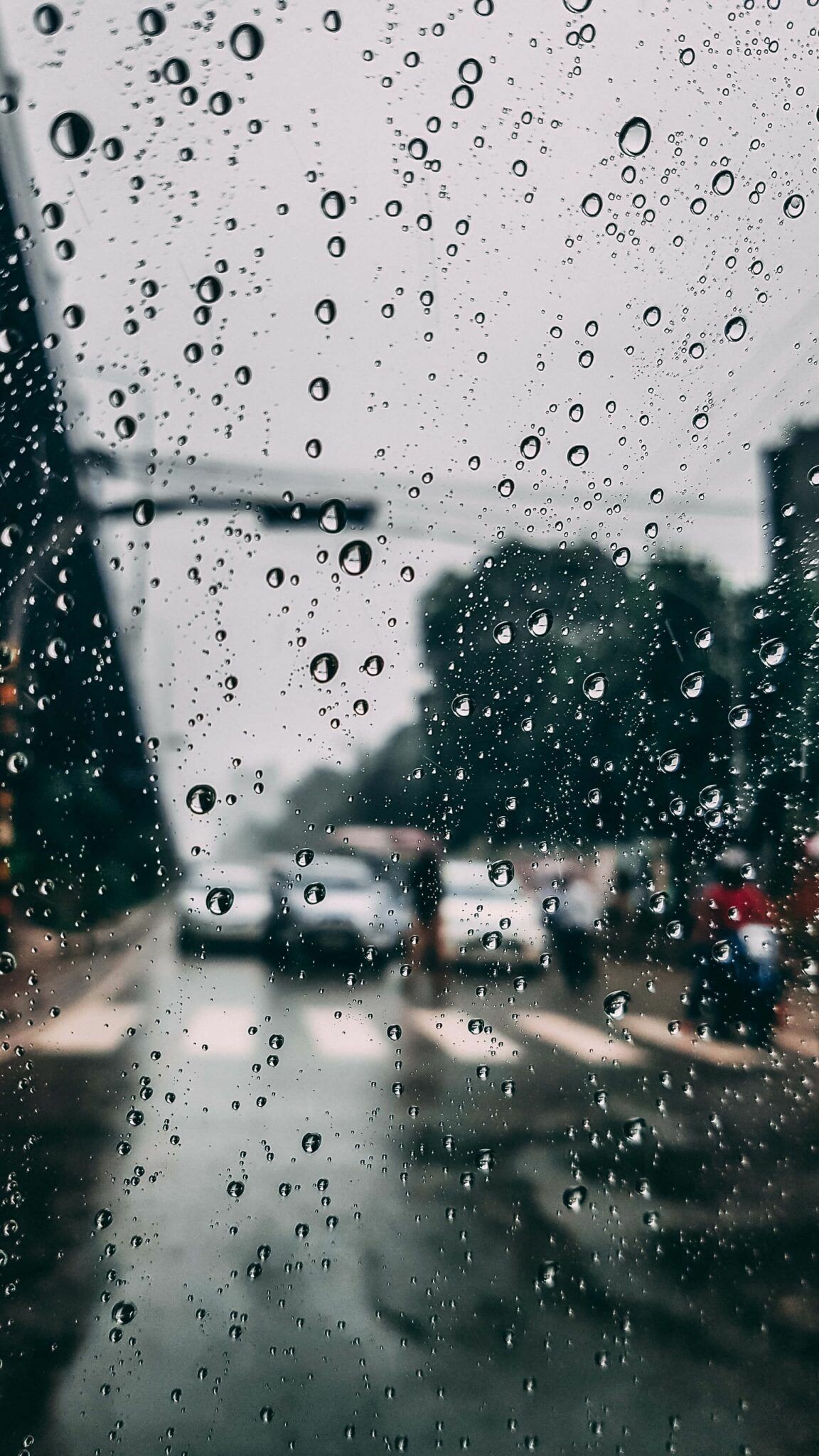 Raindrops on glass, Blurred city street, Traffic light pole Raindrops on glass, Blurred city street, Traffic light pole — 1152×2048 HD wallpaper