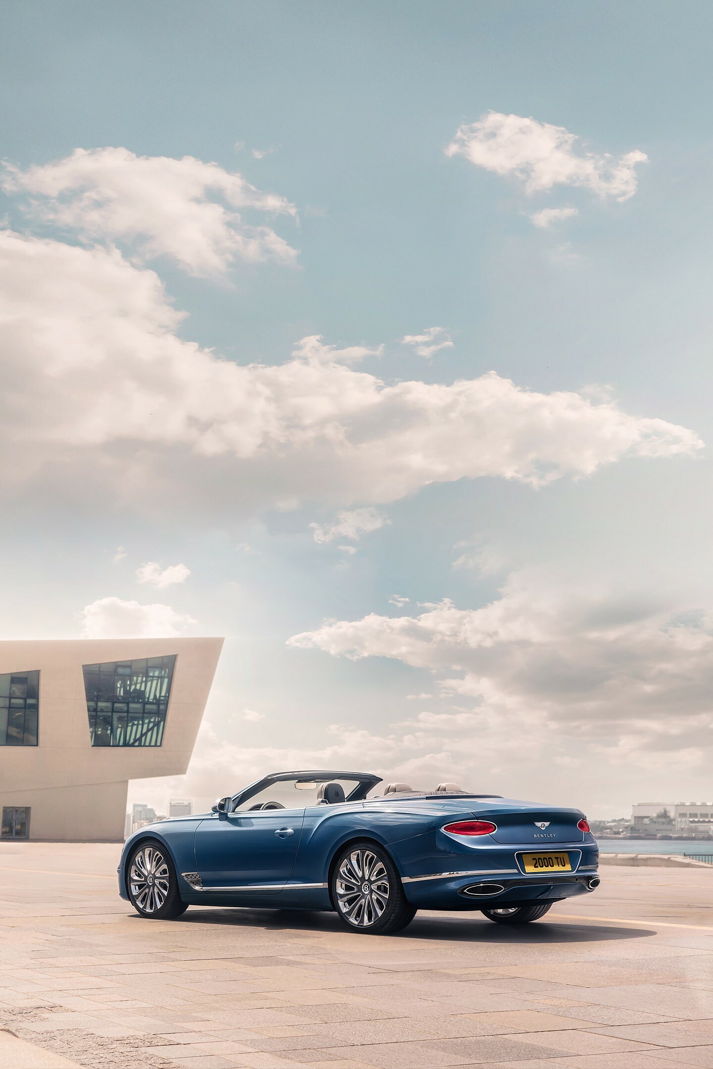 Bentley Continental GT Convertible, Modernist waterfront building, Cloudy coastal plaza Bentley Continental GT Convertible, Modernist waterfront building, Cloudy coastal plaza — 1440×2160 HD wallpaper