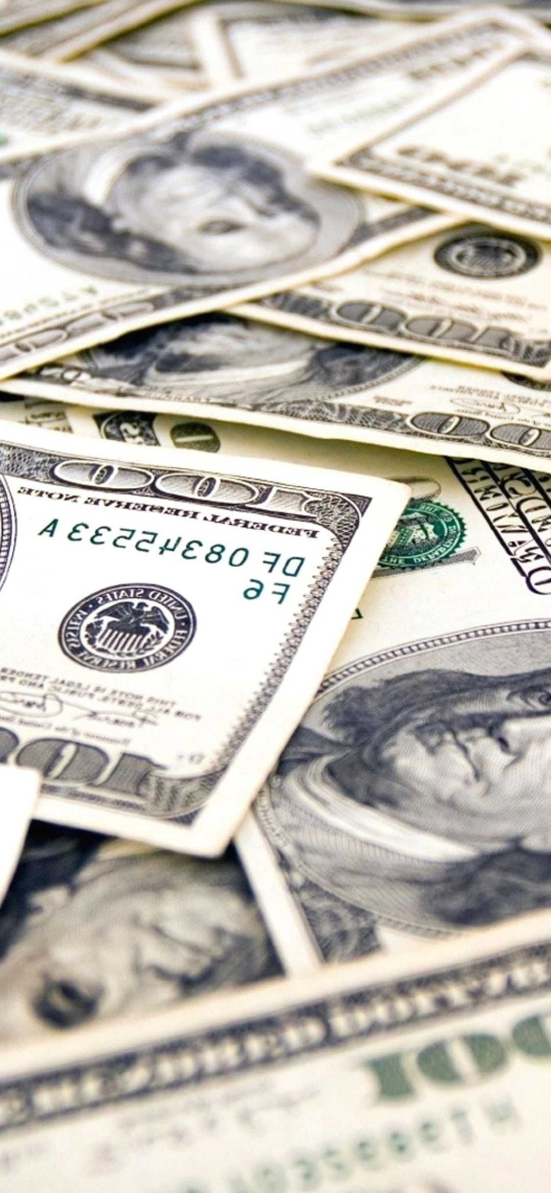 Fanned hundred-dollar bills, Benjamin Franklin portrait, Overlapping US currency closeup Fanned hundred-dollar bills, Benjamin Franklin portrait, Overlapping US currency closeup — 1125×2436 HD wallpaper