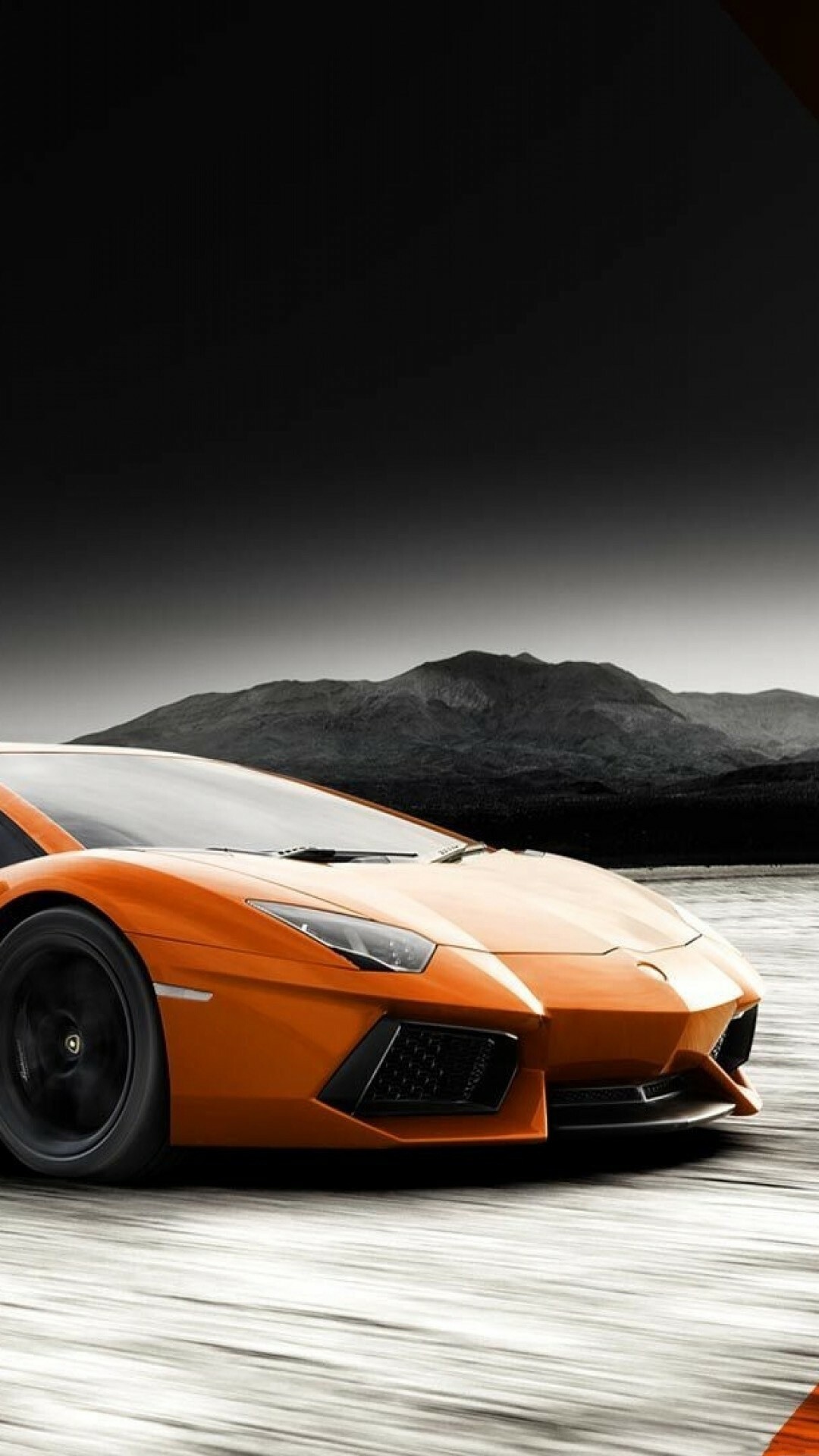 Orange Aventador LP700-4, Monochrome mountain backdrop, Front three-quarter motion Orange Aventador LP700-4, Monochrome mountain backdrop, Front three-quarter motion — 1080×1920 HD wallpaper