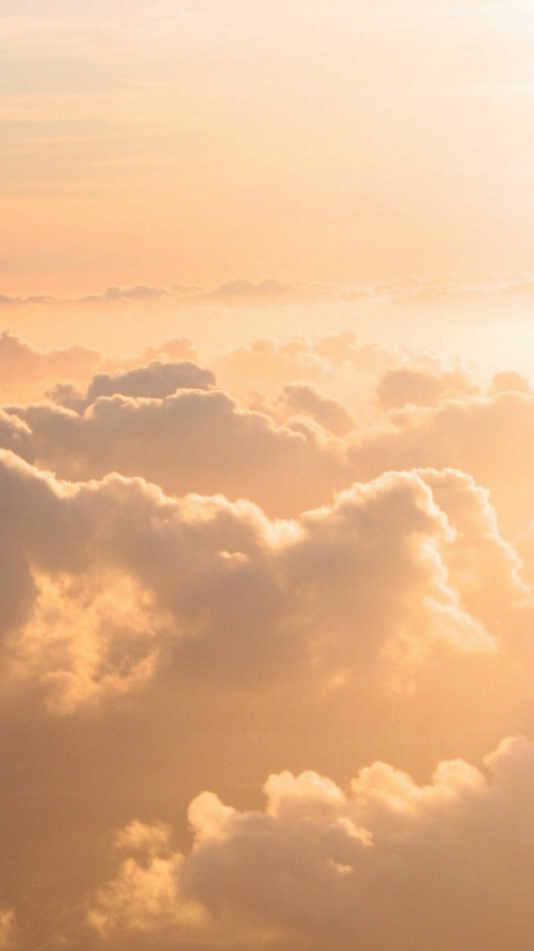 Golden sunset cumulus clouds, Above-clouds aerial view, Warm peach sky Golden sunset cumulus clouds, Above-clouds aerial view, Warm peach sky — 1080×1923 HD wallpaper