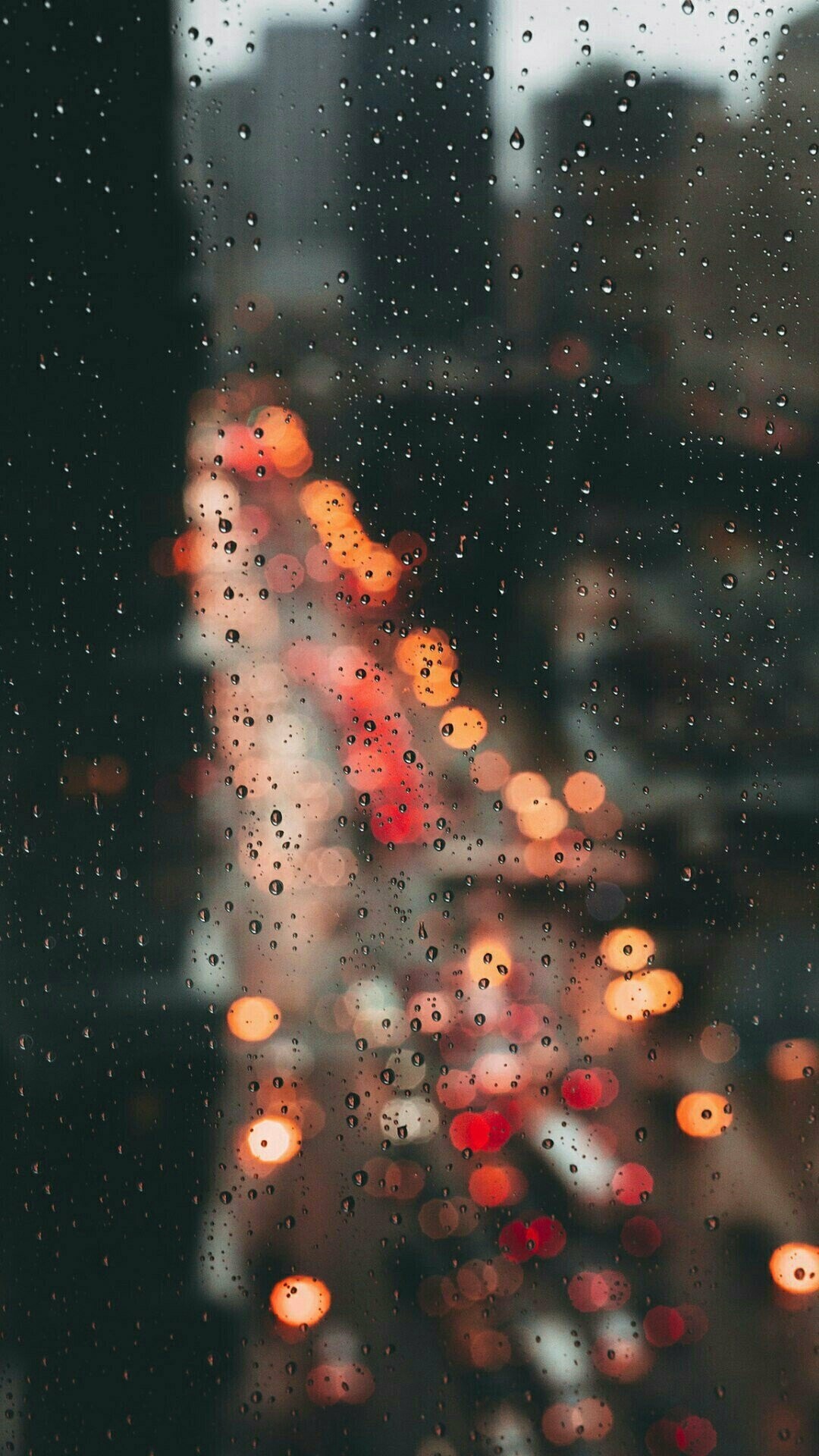 Raindrops on window, City traffic bokeh, Blurred urban skyline Raindrops on window, City traffic bokeh, Blurred urban skyline — 1080×1920 HD wallpaper