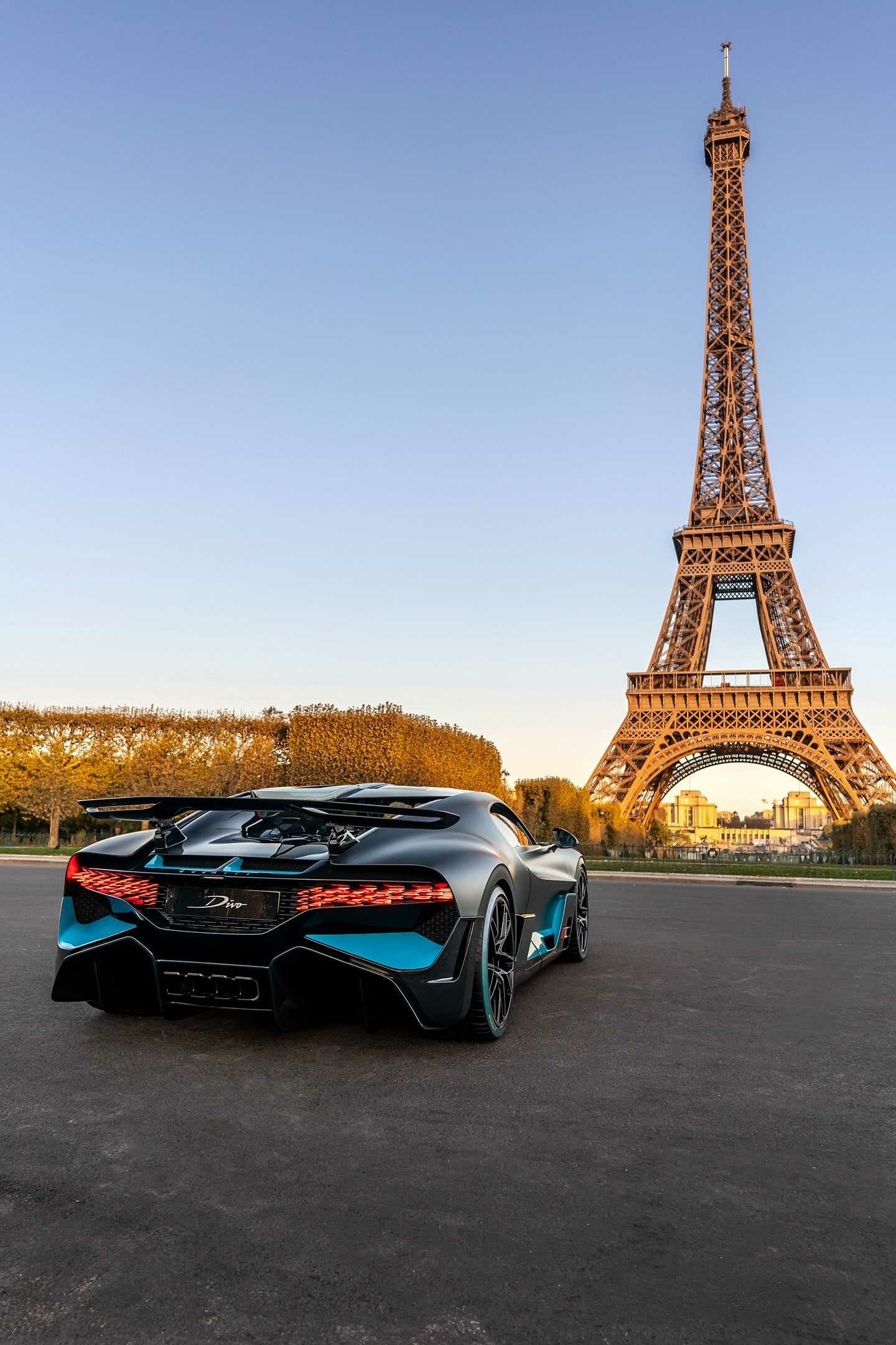 Bugatti Divo, Eiffel Tower Paris, Rear three-quarter view, Grey blue accents Bugatti Divo, Eiffel Tower Paris, Rear three-quarter view, Grey blue accents — 1440×2160 HD wallpaper