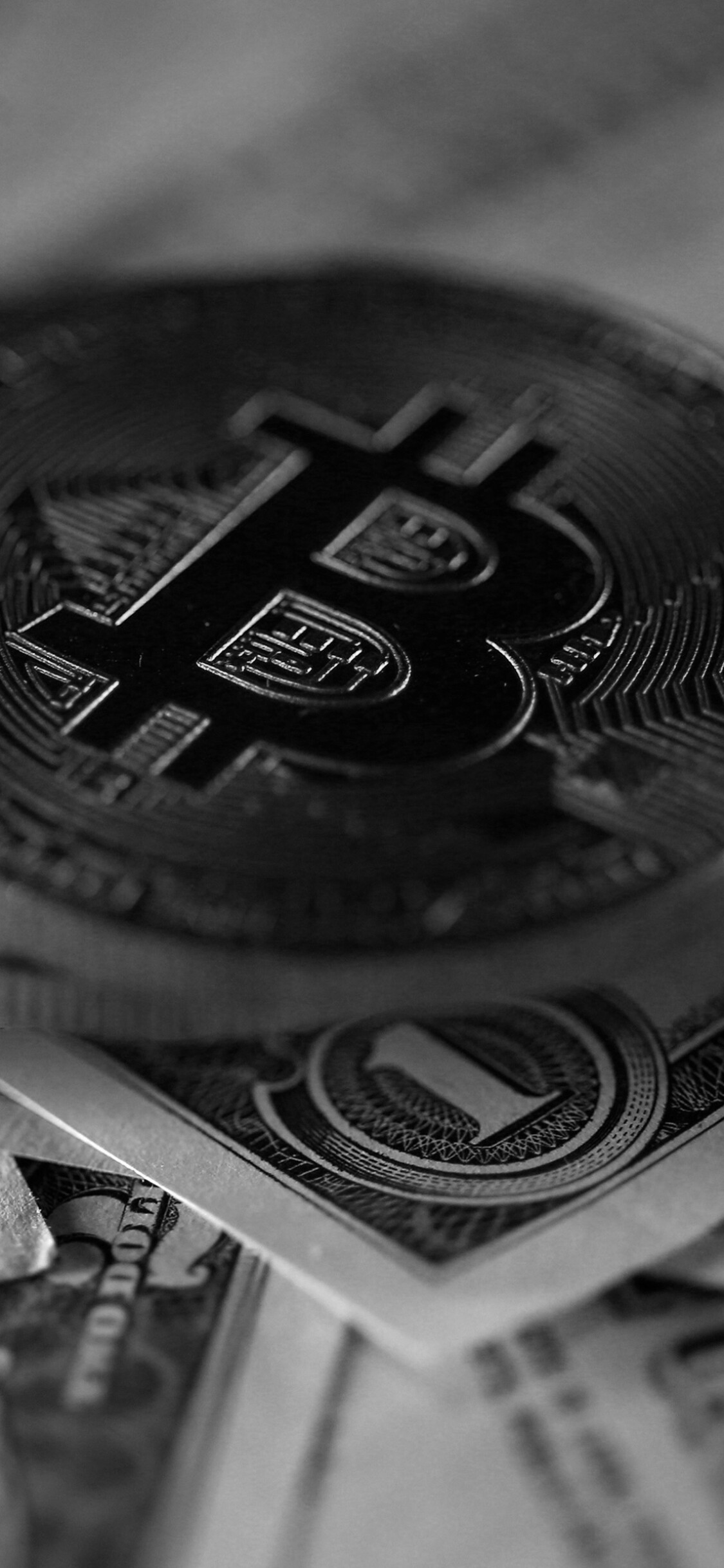 Bitcoin coin closeup, US dollar bills, Black and white Bitcoin coin closeup, US dollar bills, Black and white — 1125×2436 HD wallpaper
