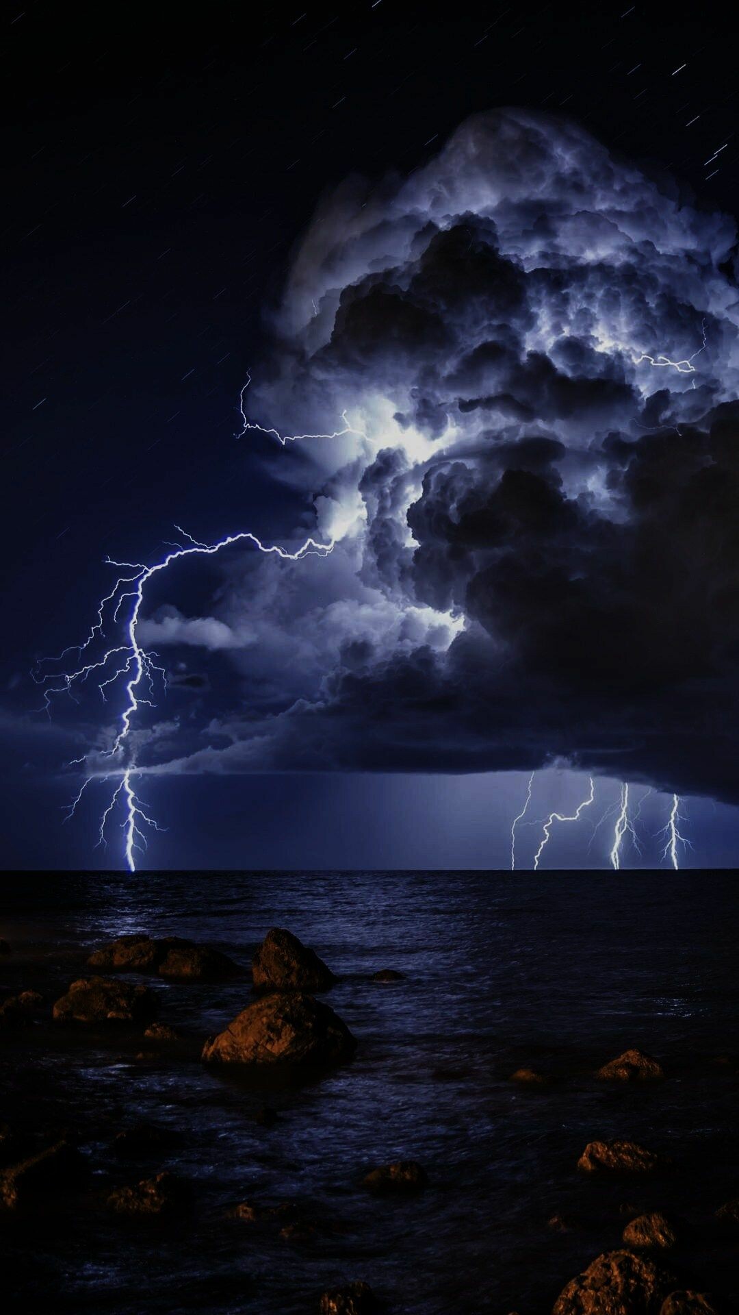 Lightning bolts over ocean, Cumulonimbus storm cloud, Rocky shoreline night Lightning bolts over ocean, Cumulonimbus storm cloud, Rocky shoreline night — 1080×1920 HD wallpaper