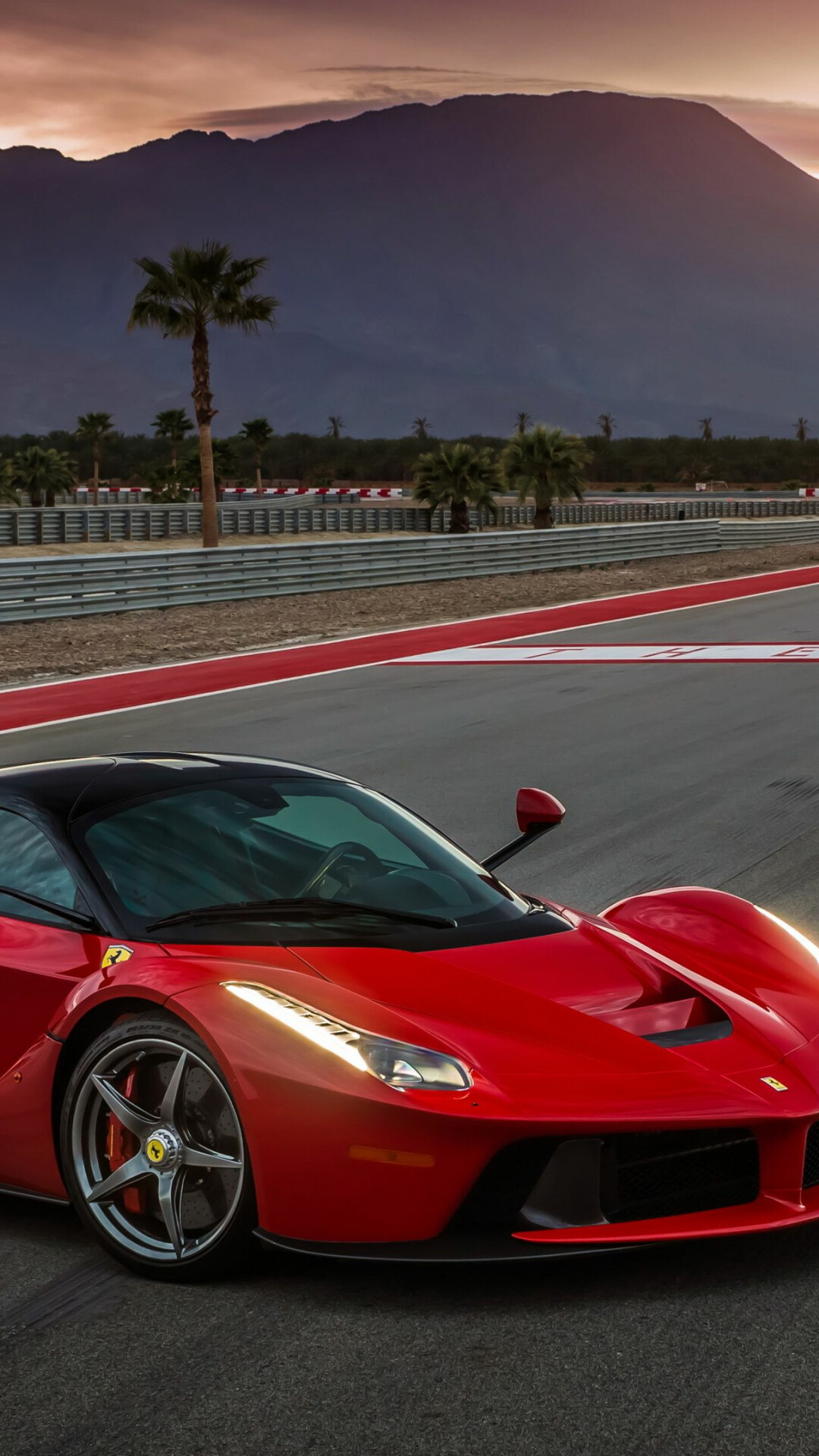 Red LaFerrari, Racetrack curbs, Desert mountains at dusk — 1080×1920 HD wallpaper