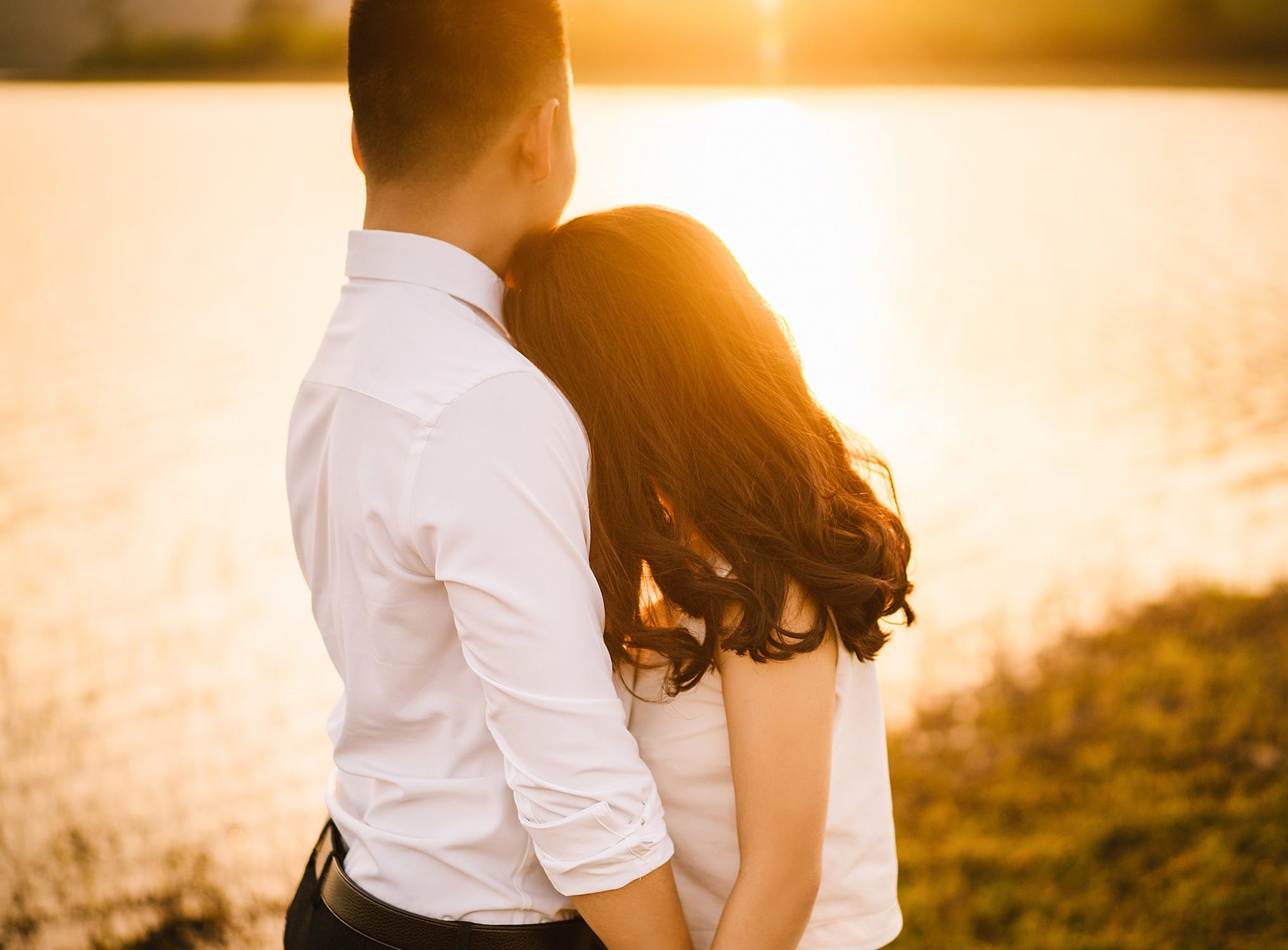 Couple embracing from behind, Golden hour lakeside, Woman resting on shoulder — 2033×1500 HD wallpaper