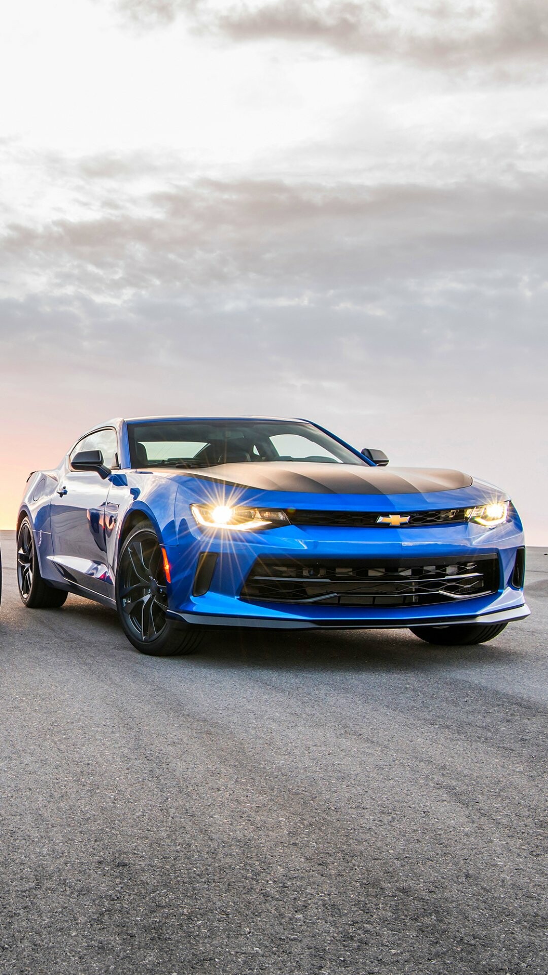 Chevrolet Camaro SS, Blue coupe headlights on, Cloudy sunset sky Chevrolet Camaro SS, Blue coupe headlights on, Cloudy sunset sky — 1080×1920 HD wallpaper