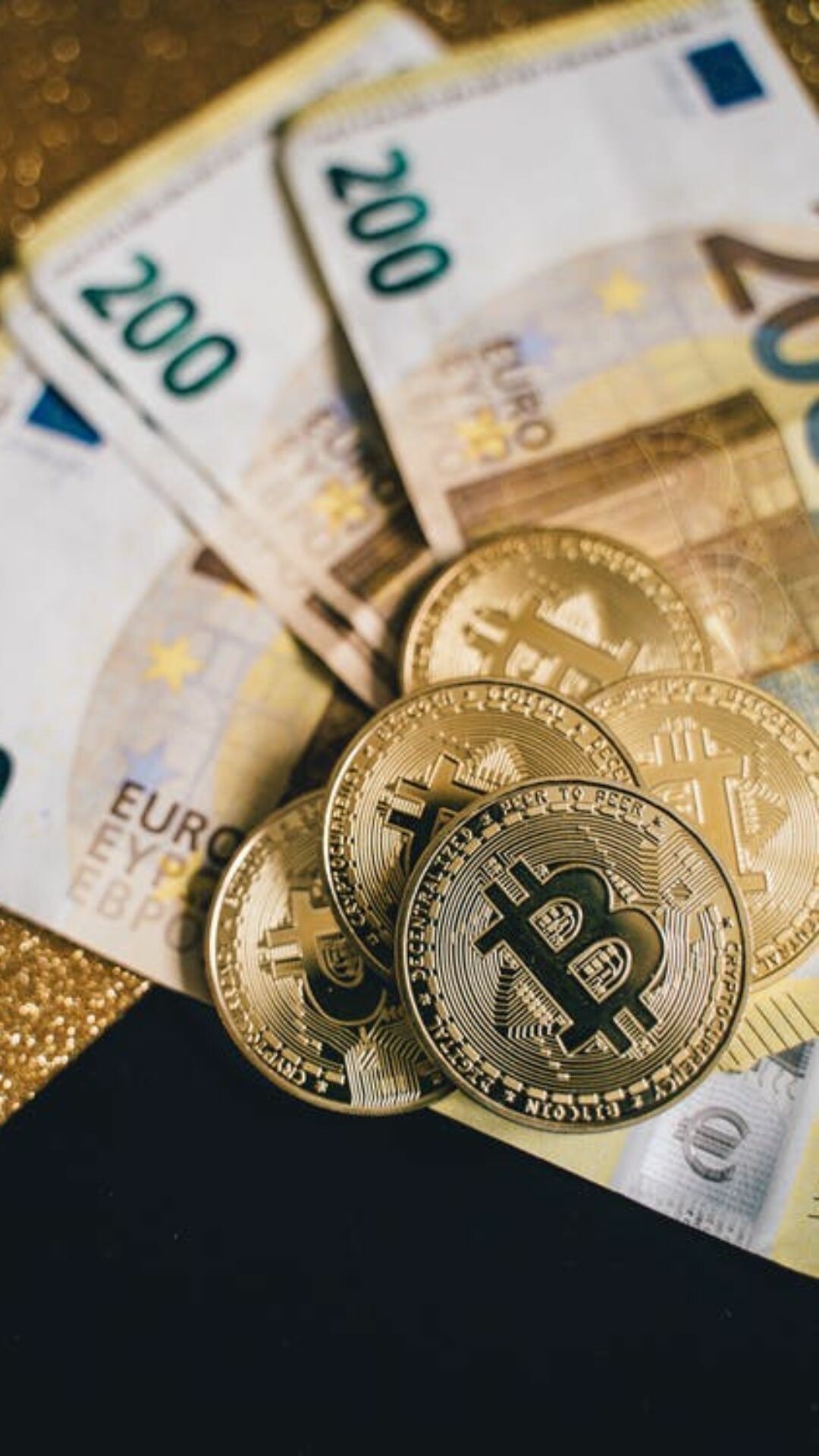 Gold Bitcoin coins, 200 Euro banknotes, Stacked currency closeup Gold Bitcoin coins, 200 Euro banknotes, Stacked currency closeup — 1080×1920 HD wallpaper