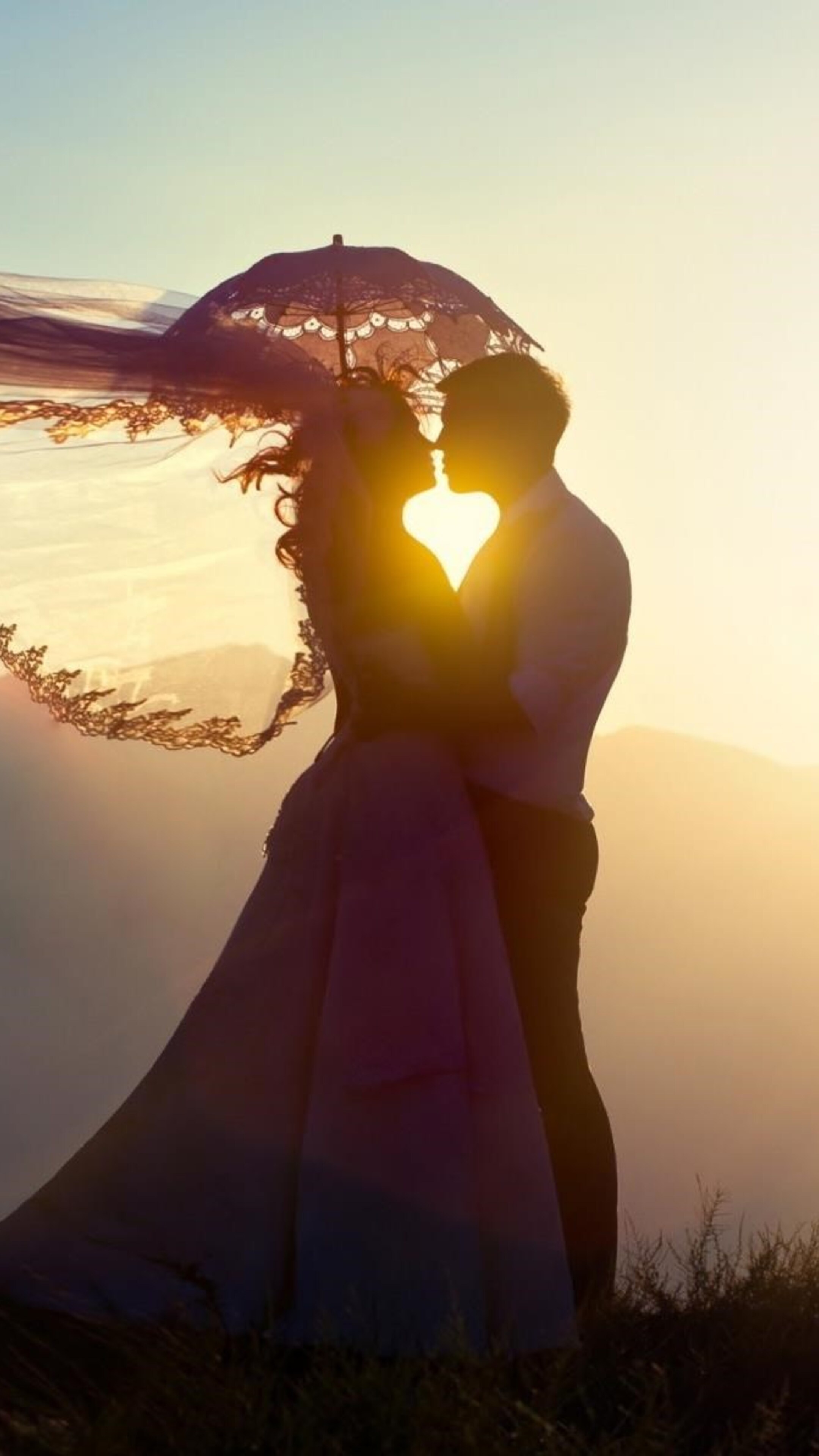 Bride and groom kissing, Lace parasol sunset backlight, Hilltop golden glow Bride and groom kissing, Lace parasol sunset backlight, Hilltop golden glow — 2160×3840 HD wallpaper
