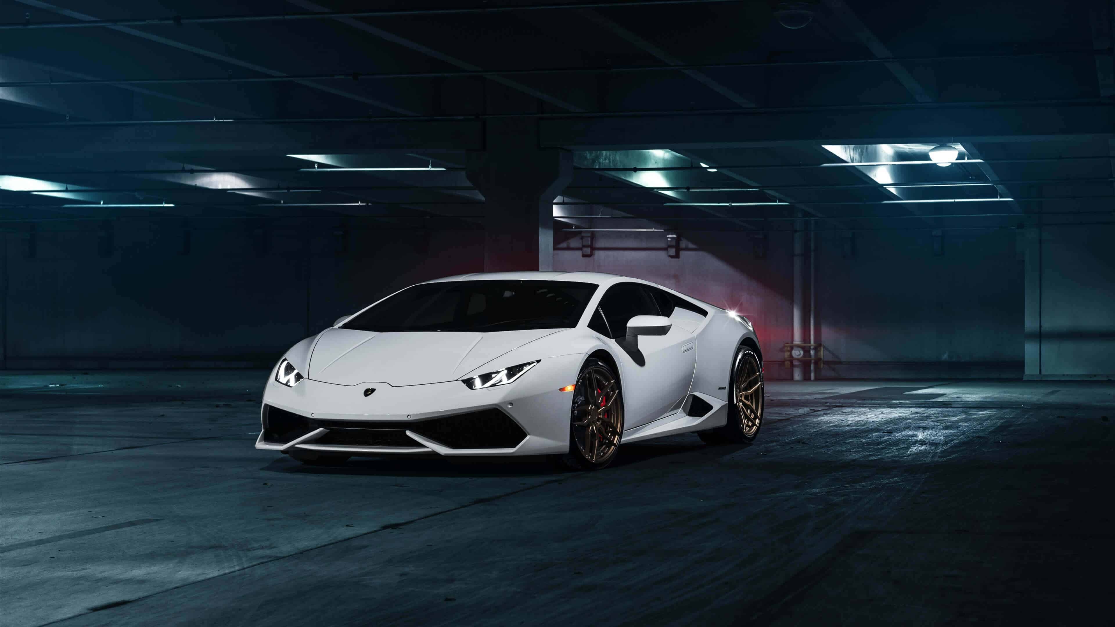 White Lamborghini Huracan, Dark parking garage, Bronze alloy wheels White Lamborghini Huracan, Dark parking garage, Bronze alloy wheels — 3840×2160 HD wallpaper