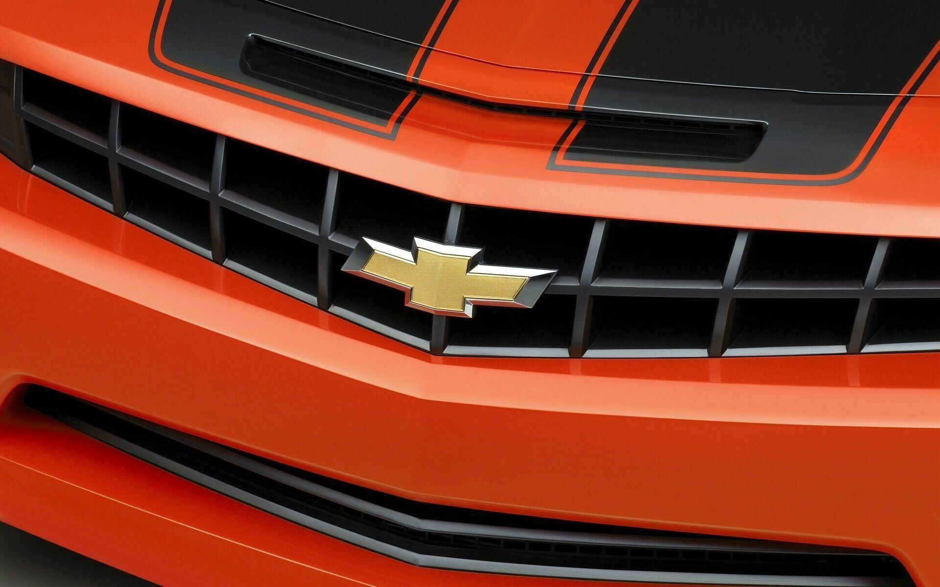 Chevrolet Camaro grille, Gold bowtie emblem, Orange black racing stripes Chevrolet Camaro grille, Gold bowtie emblem, Orange black racing stripes — 1920×1200 HD wallpaper