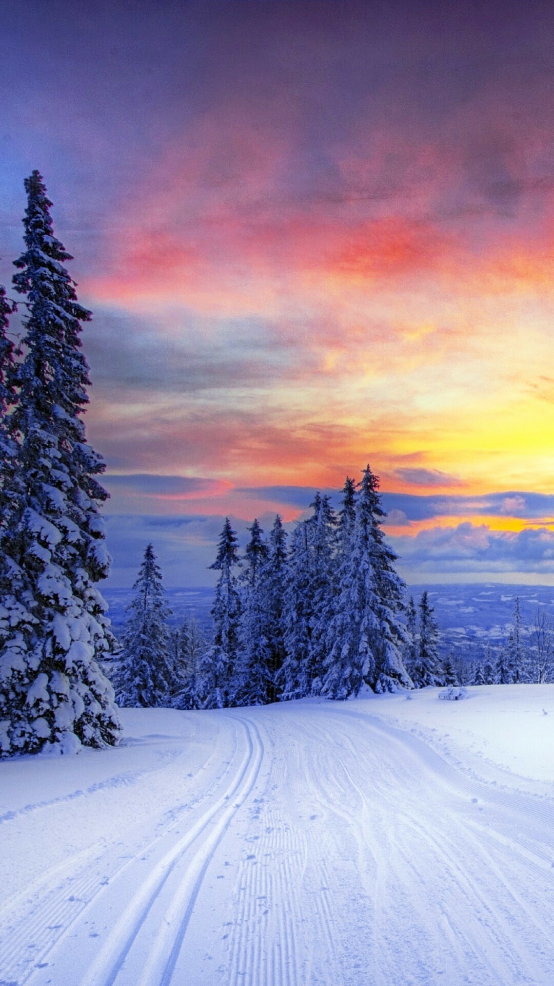 Snow-covered pine trees, Ski track trail, Pink sunset sky Snow-covered pine trees, Ski track trail, Pink sunset sky — 1080×1920 HD wallpaper