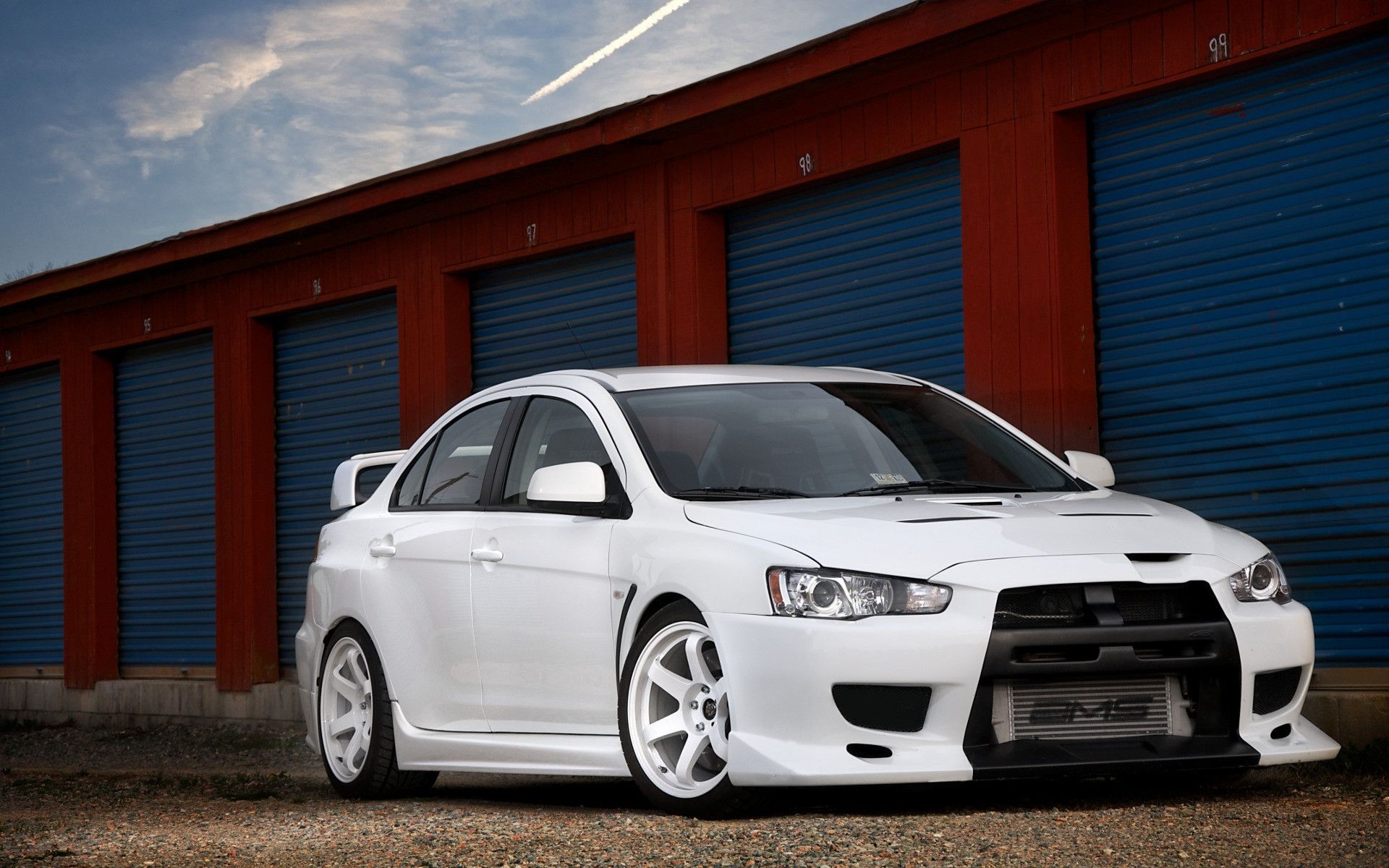 Mitsubishi Lancer Evolution X, White sedan, Blue storage unit doors Mitsubishi Lancer Evolution X, White sedan, Blue storage unit doors — 1920×1200 HD wallpaper