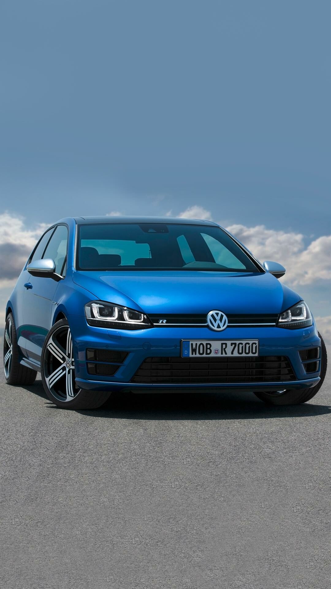 Volkswagen Golf R, WOB R7000 plate, Blue hatchback, Cloudy sky backdrop Volkswagen Golf R, WOB R7000 plate, Blue hatchback, Cloudy sky backdrop — 1080×1920 HD wallpaper