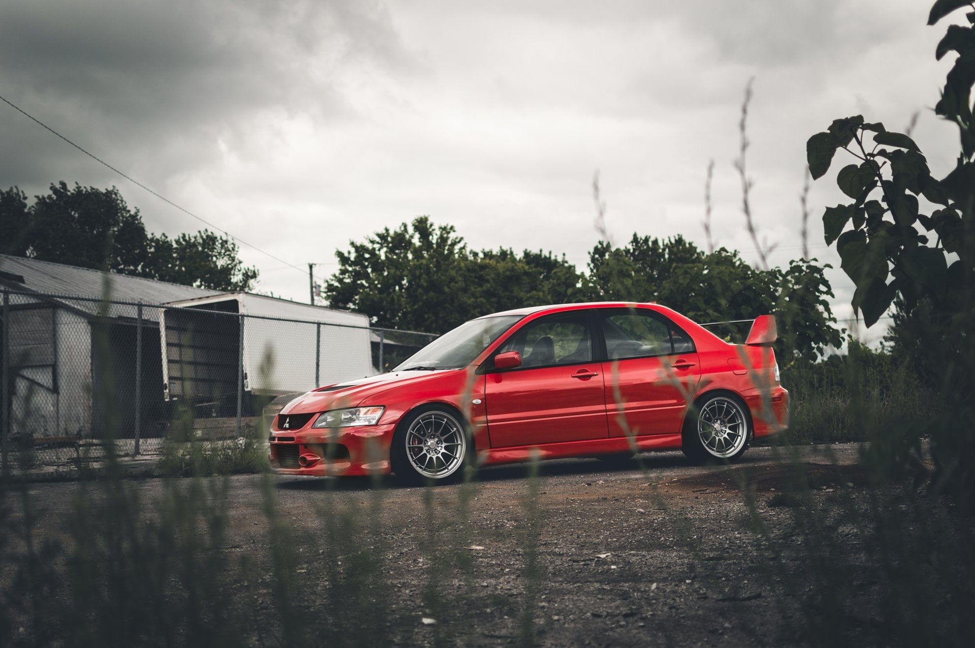 Mitsubishi Lancer Evo IX, Red sedan rear spoiler, Overcast industrial lot Mitsubishi Lancer Evo IX, Red sedan rear spoiler, Overcast industrial lot — 1920×1277 HD wallpaper